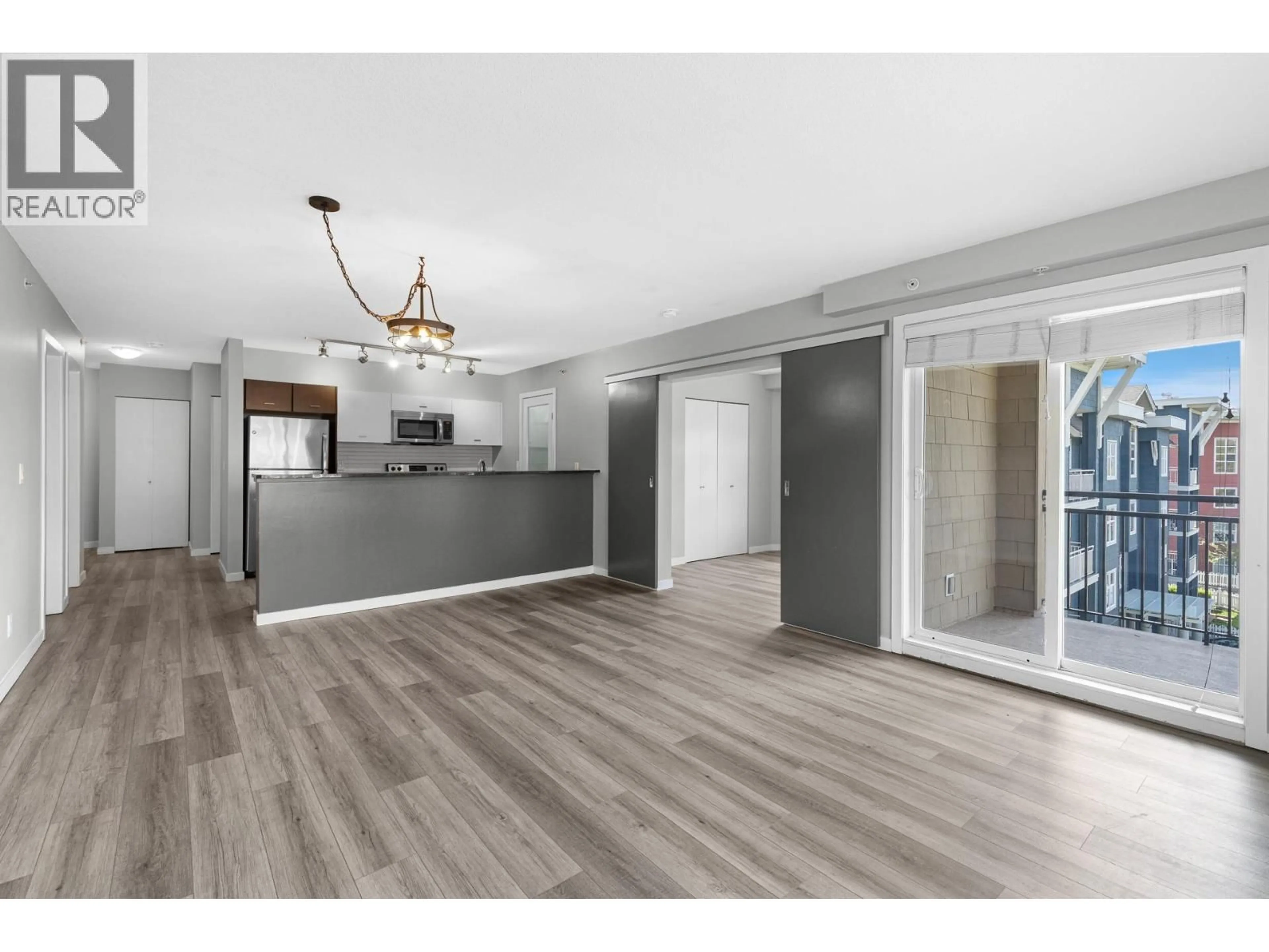 Open concept kitchen, wood/laminate floor for 401 - 547 YATES ROAD, Kelowna British Columbia V1V2T7