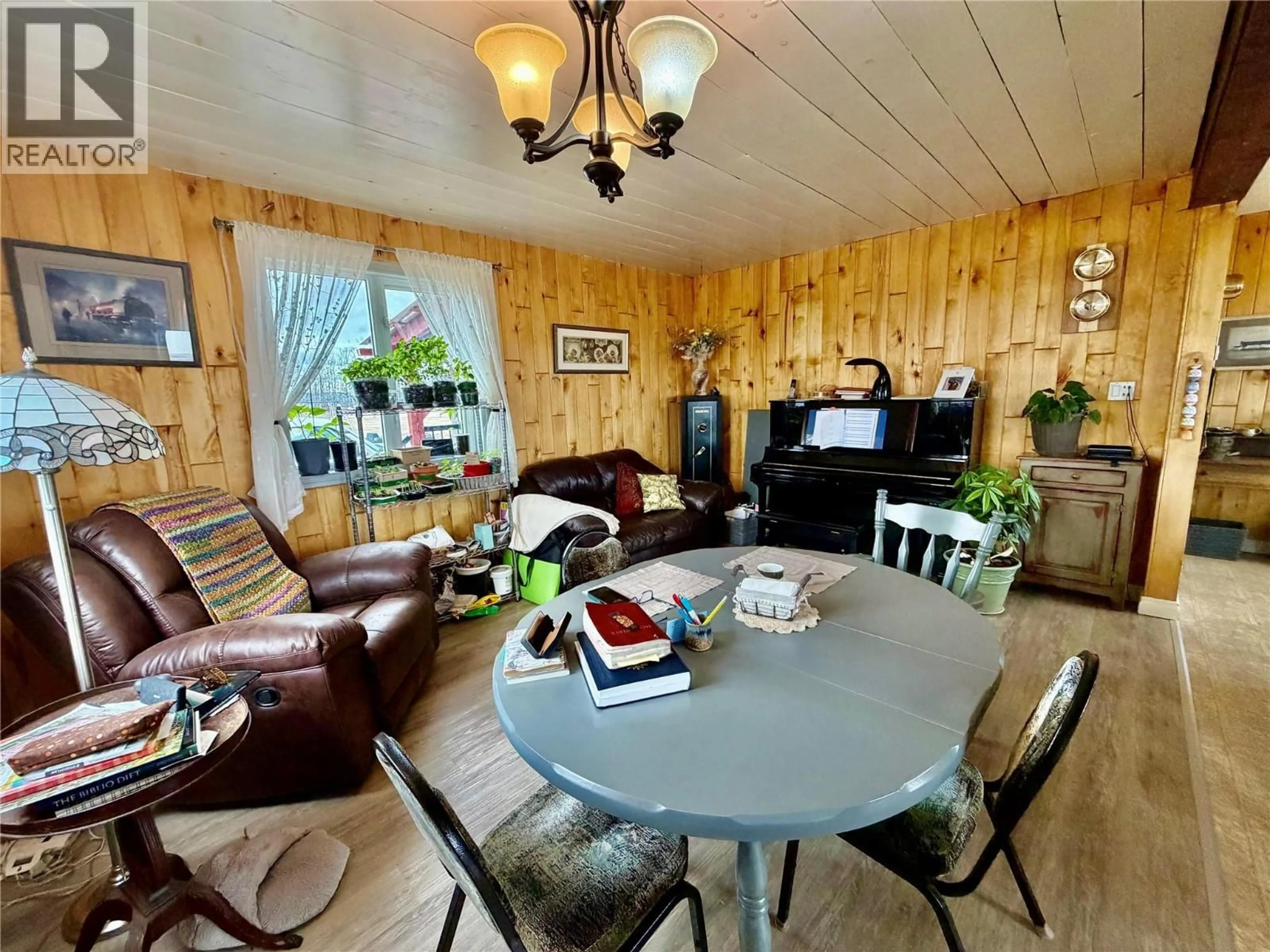 Living room with furniture, wood/laminate floor for 13131 BEDELL ROAD, Dawson Creek British Columbia V0C1B0