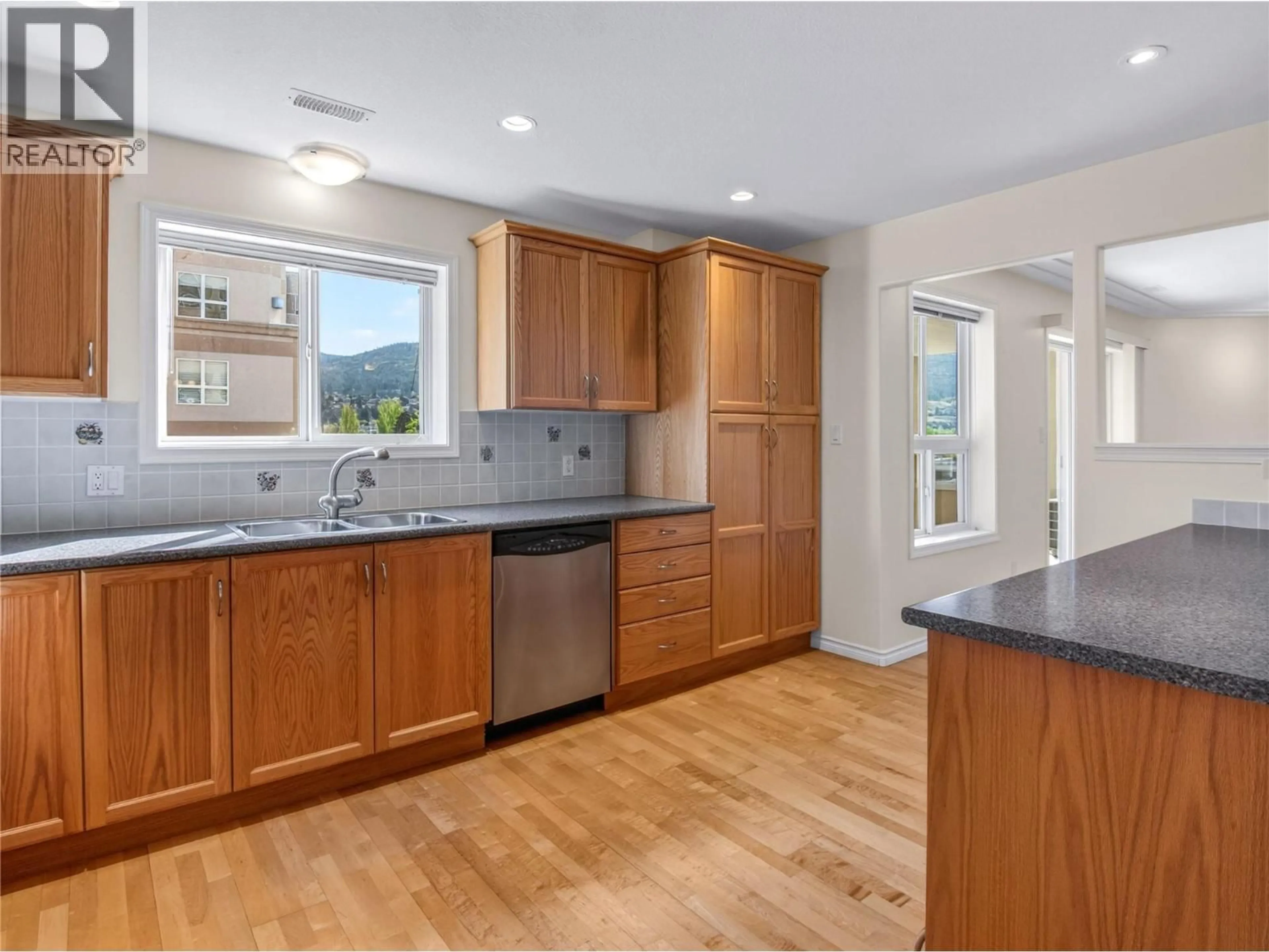 Open concept kitchen, unknown for 404 - 2285 ATKINSON STREET, Penticton British Columbia V2A8R7