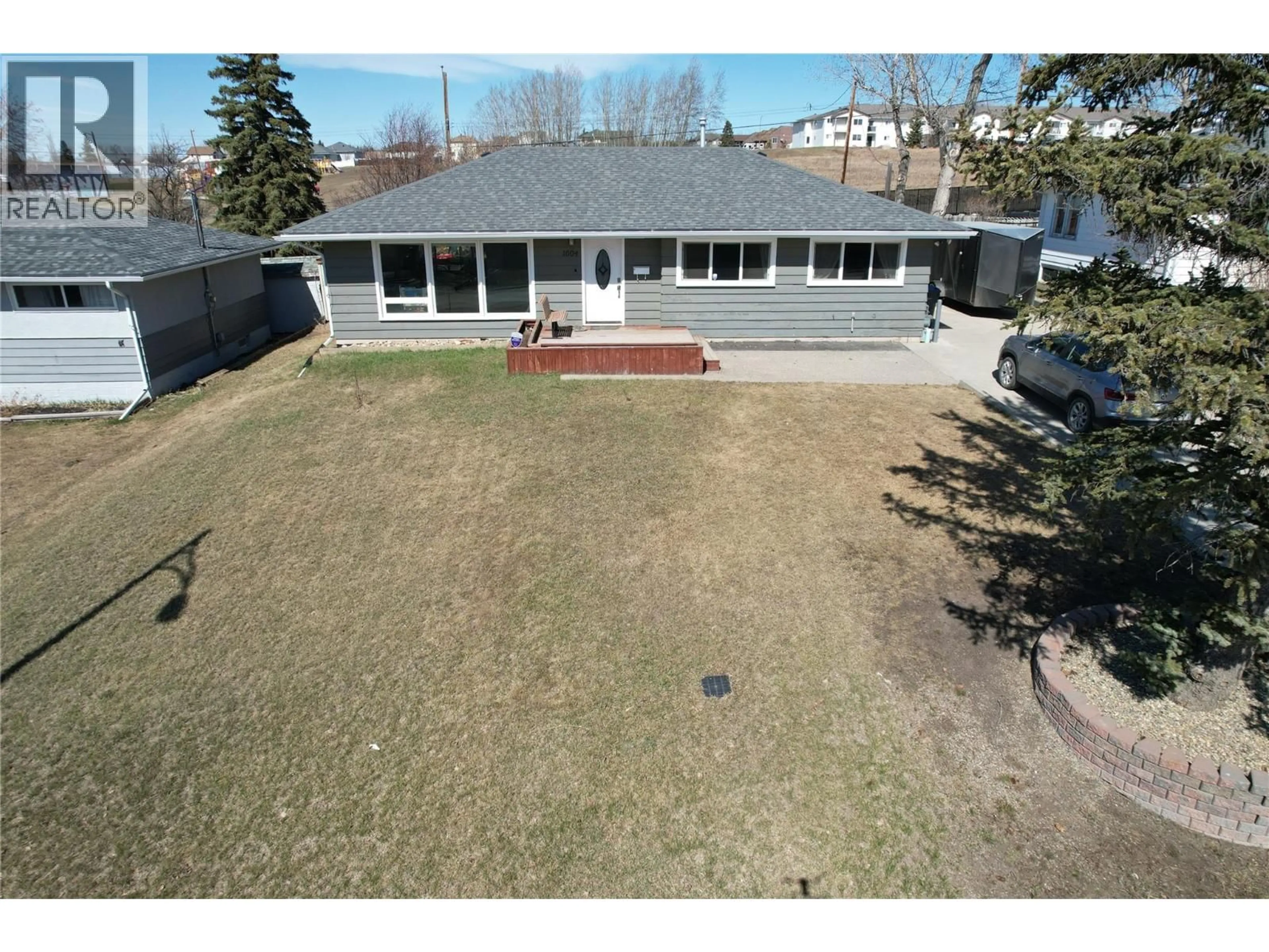 A pic from outside/outdoor area/front of a property/back of a property/a pic from drone, street for 1604 94 AVENUE, Dawson Creek British Columbia V1G1H1