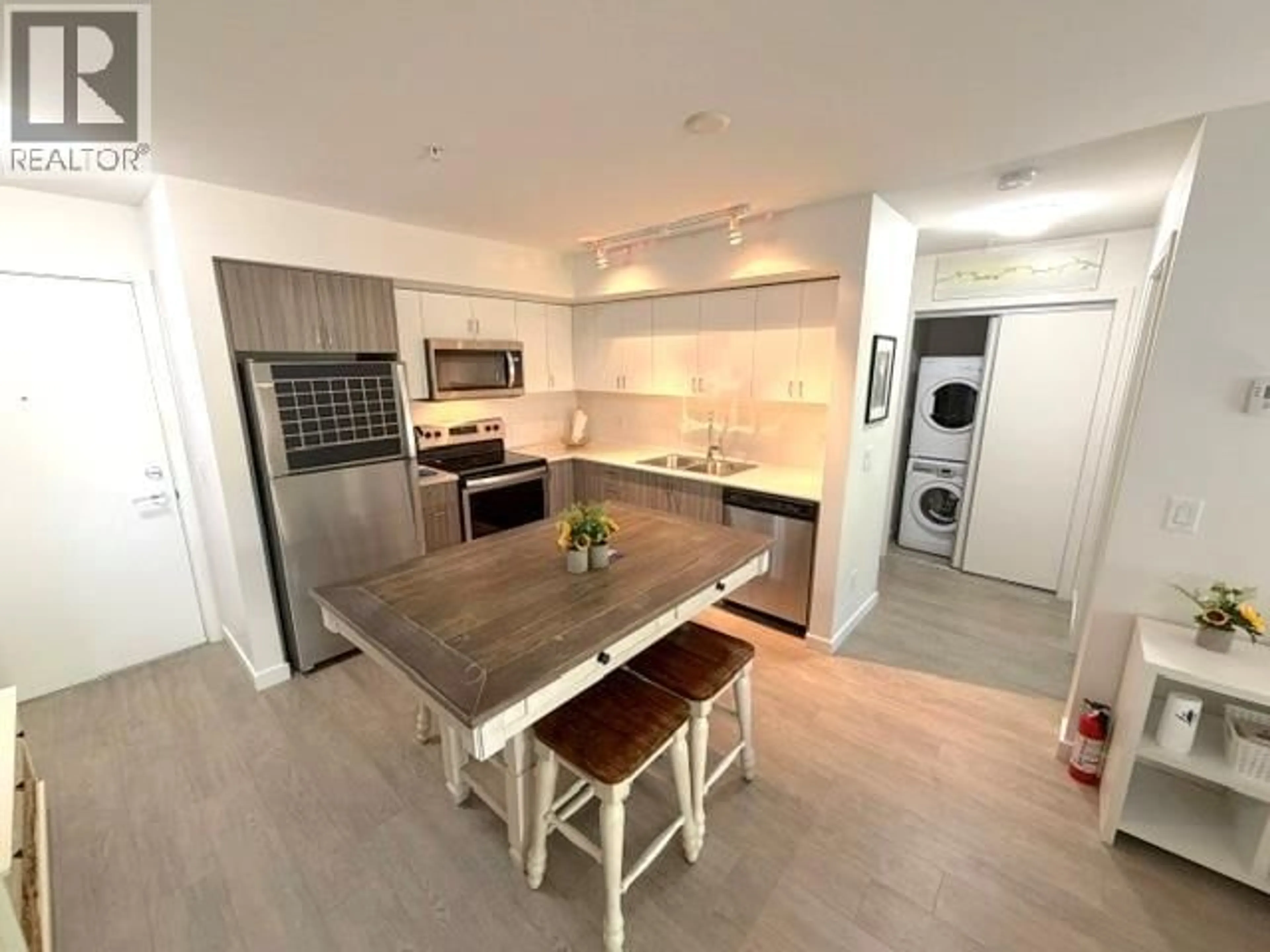 Open concept kitchen, unknown for 211 - 725 ACADEMY WAY, Kelowna British Columbia V1V0B4