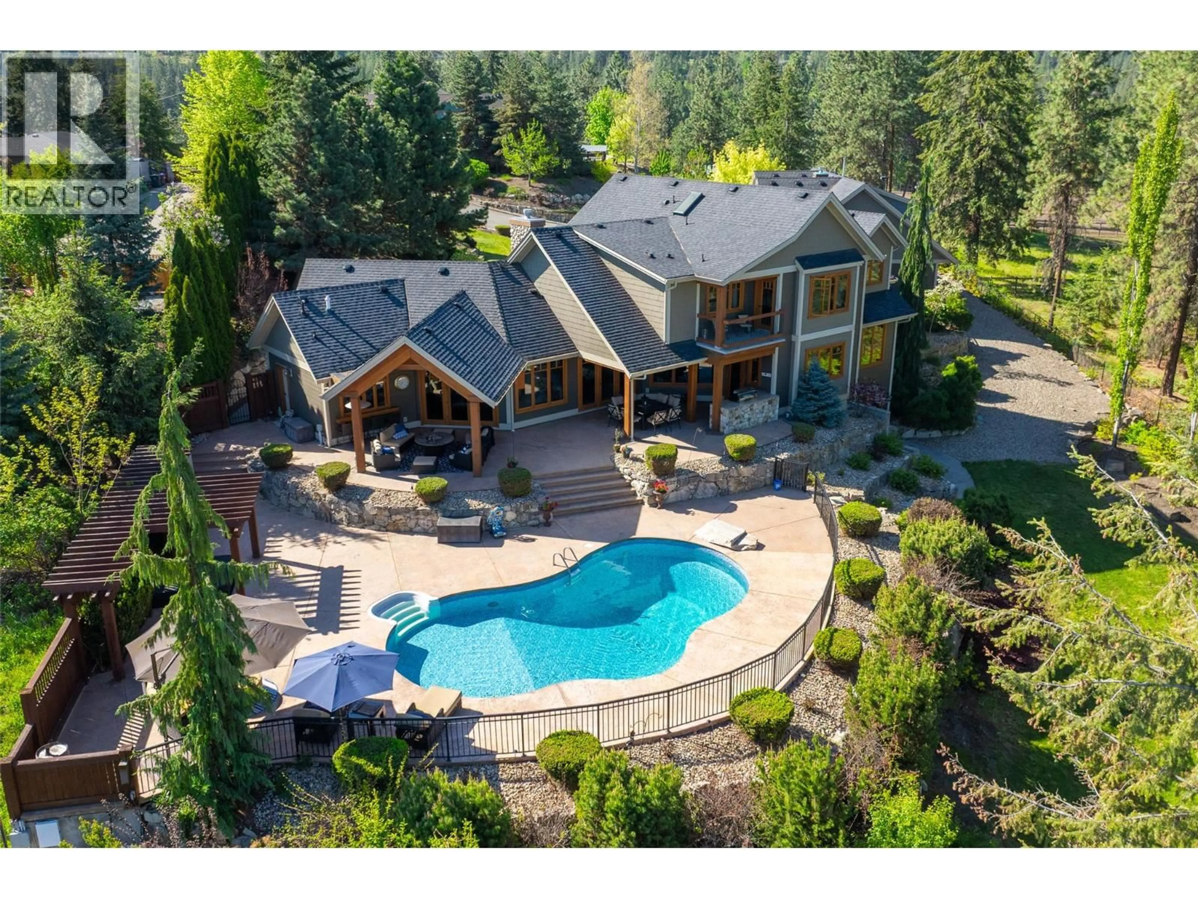 A pic from outside/outdoor area/front of a property/back of a property/a pic from drone, mountain view for 4150 SEDDON ROAD, Kelowna British Columbia V1W4C9