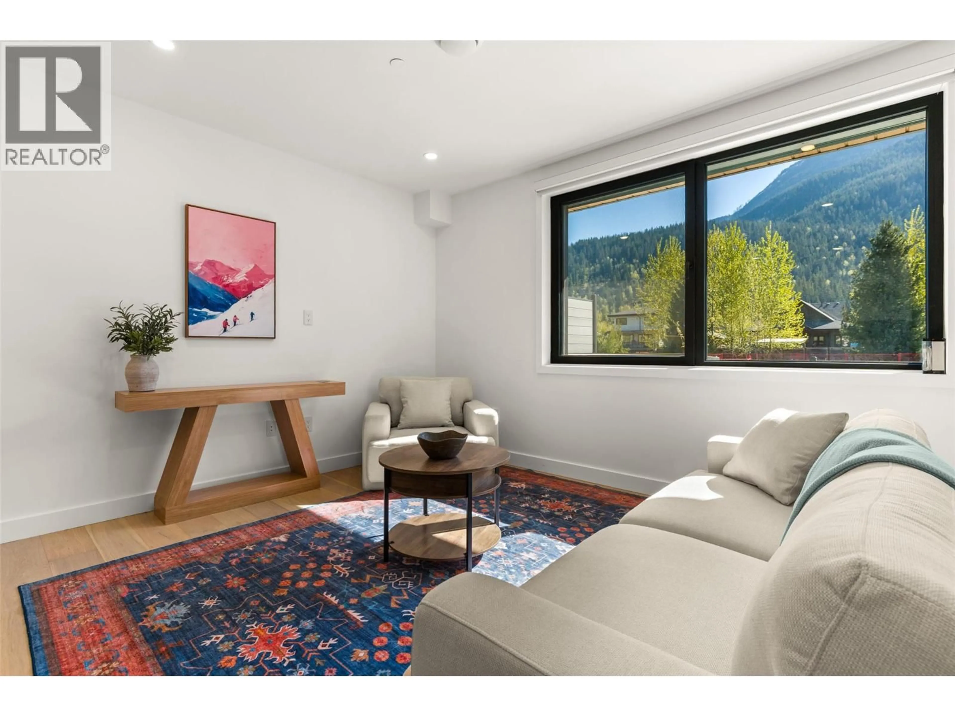 Living room with furniture, wood/laminate floor for 1104 - 1702 COURSIER AVENUE, Revelstoke British Columbia V0E2S1