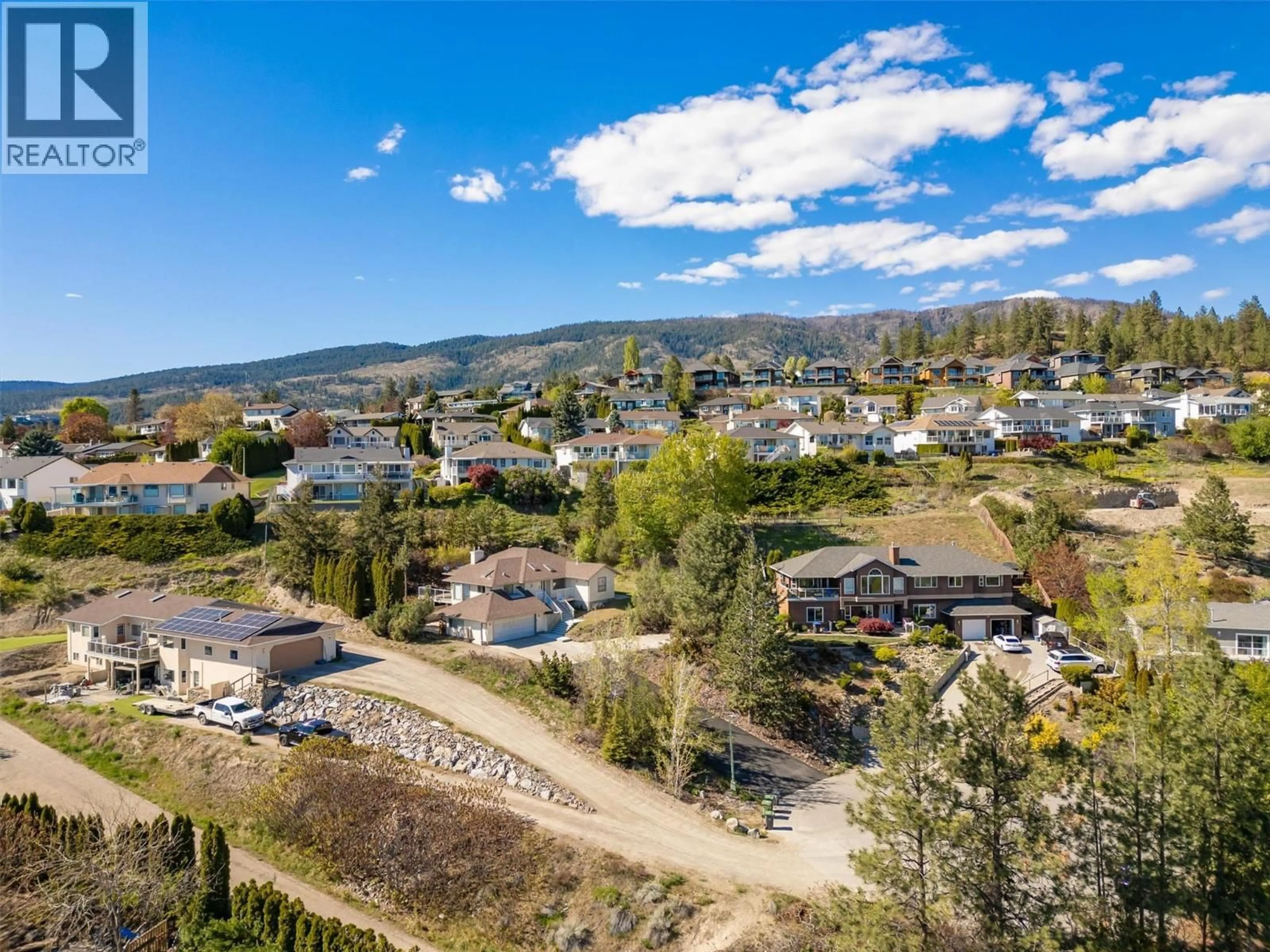 A pic from outside/outdoor area/front of a property/back of a property/a pic from drone, mountain view for 2194 SHAMROCK DRIVE, West Kelowna British Columbia V4T1T9