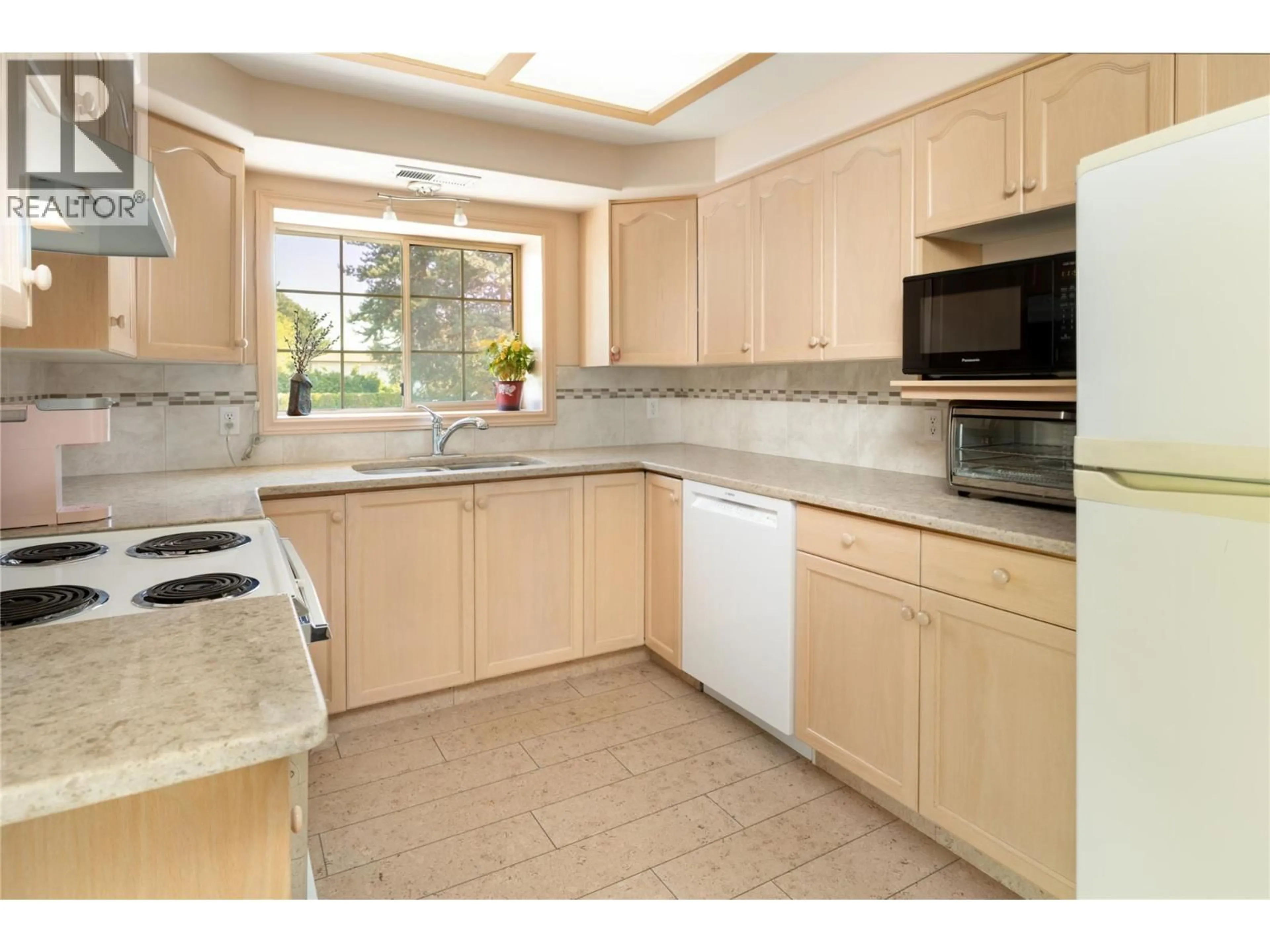 Standard kitchen, ceramic/tile floor for 215 - 3335 RICHTER STREET, Kelowna British Columbia V1W3Y1