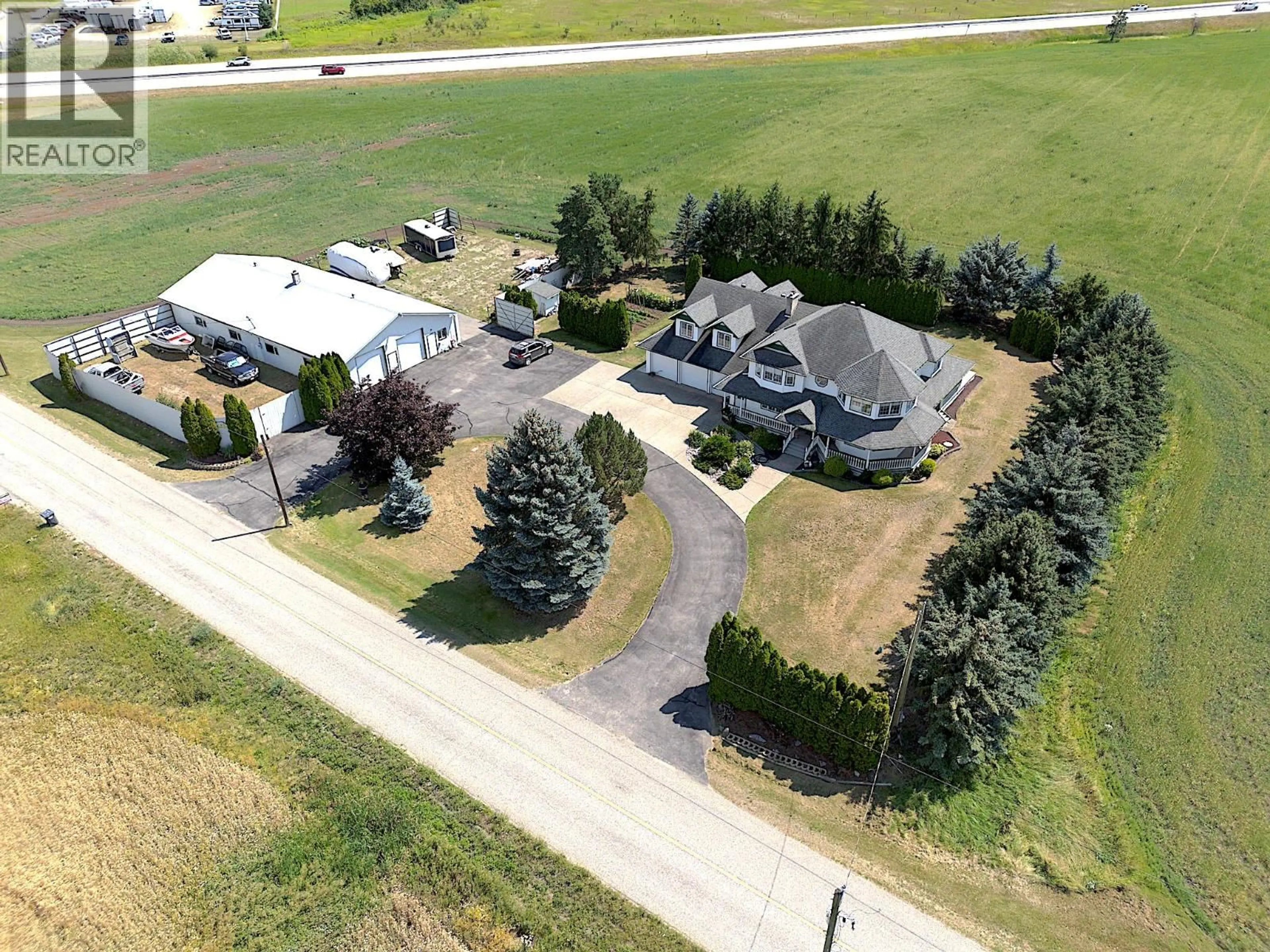 A pic from outside/outdoor area/front of a property/back of a property/a pic from drone, street for 135 PLEASANT VALLEY CROSS ROAD, Armstrong British Columbia V4Y0W1