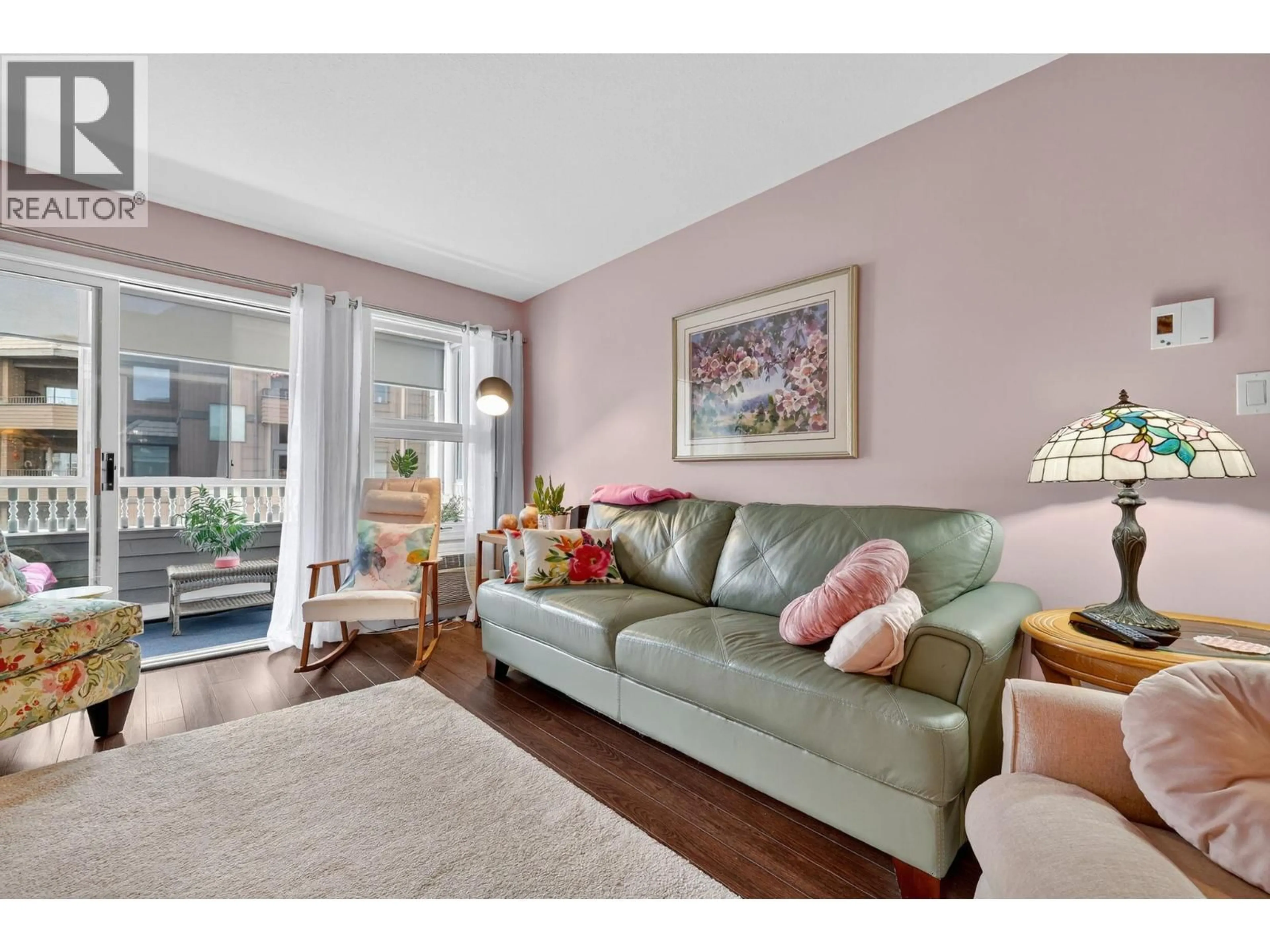 Living room with furniture, wood/laminate floor for 207 - 575 SUTHERLAND AVENUE, Kelowna British Columbia V1Y8V1