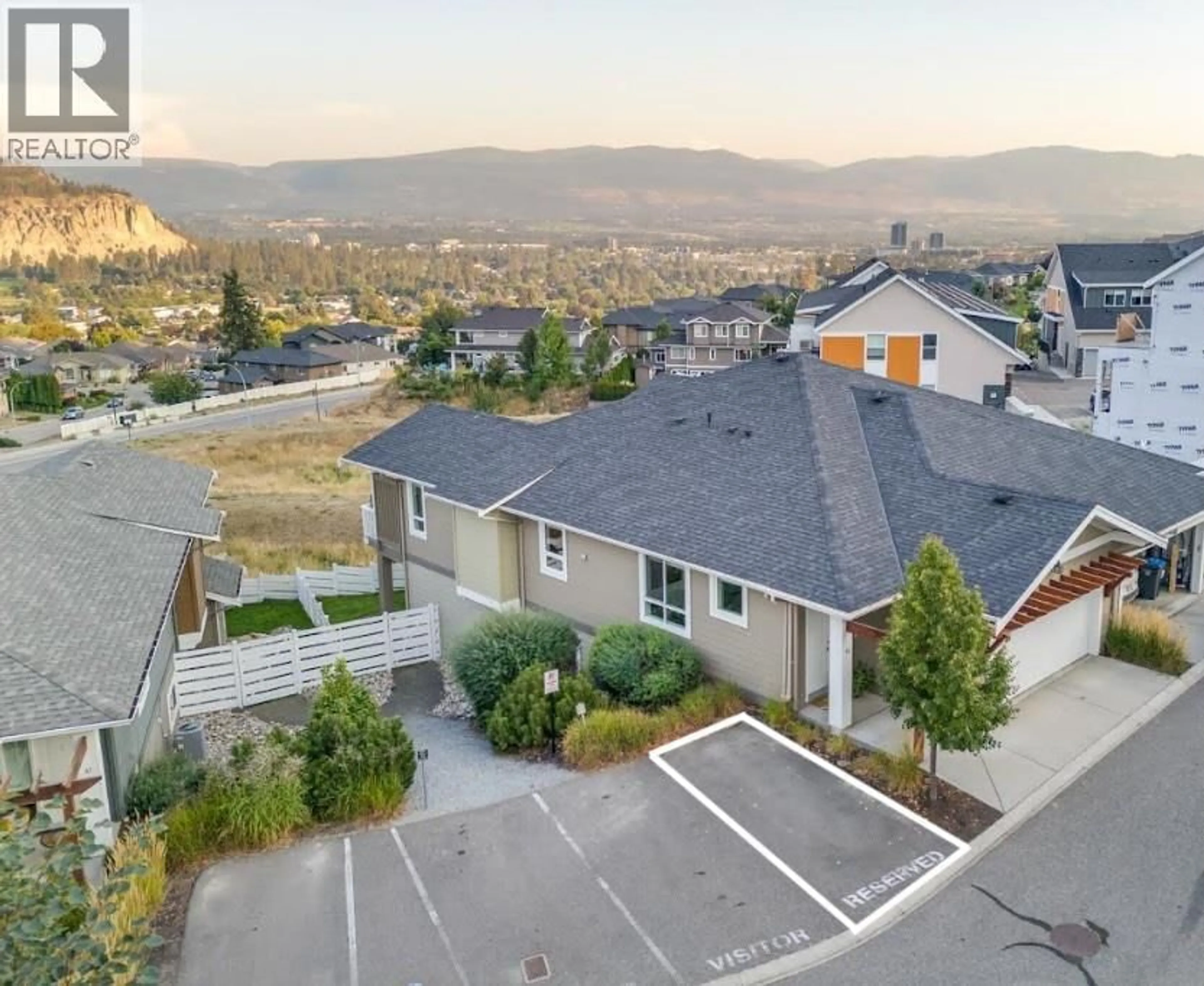 A pic from outside/outdoor area/front of a property/back of a property/a pic from drone, mountain view for 46 - 625 BOYNTON PLACE, Kelowna British Columbia V1V3B5