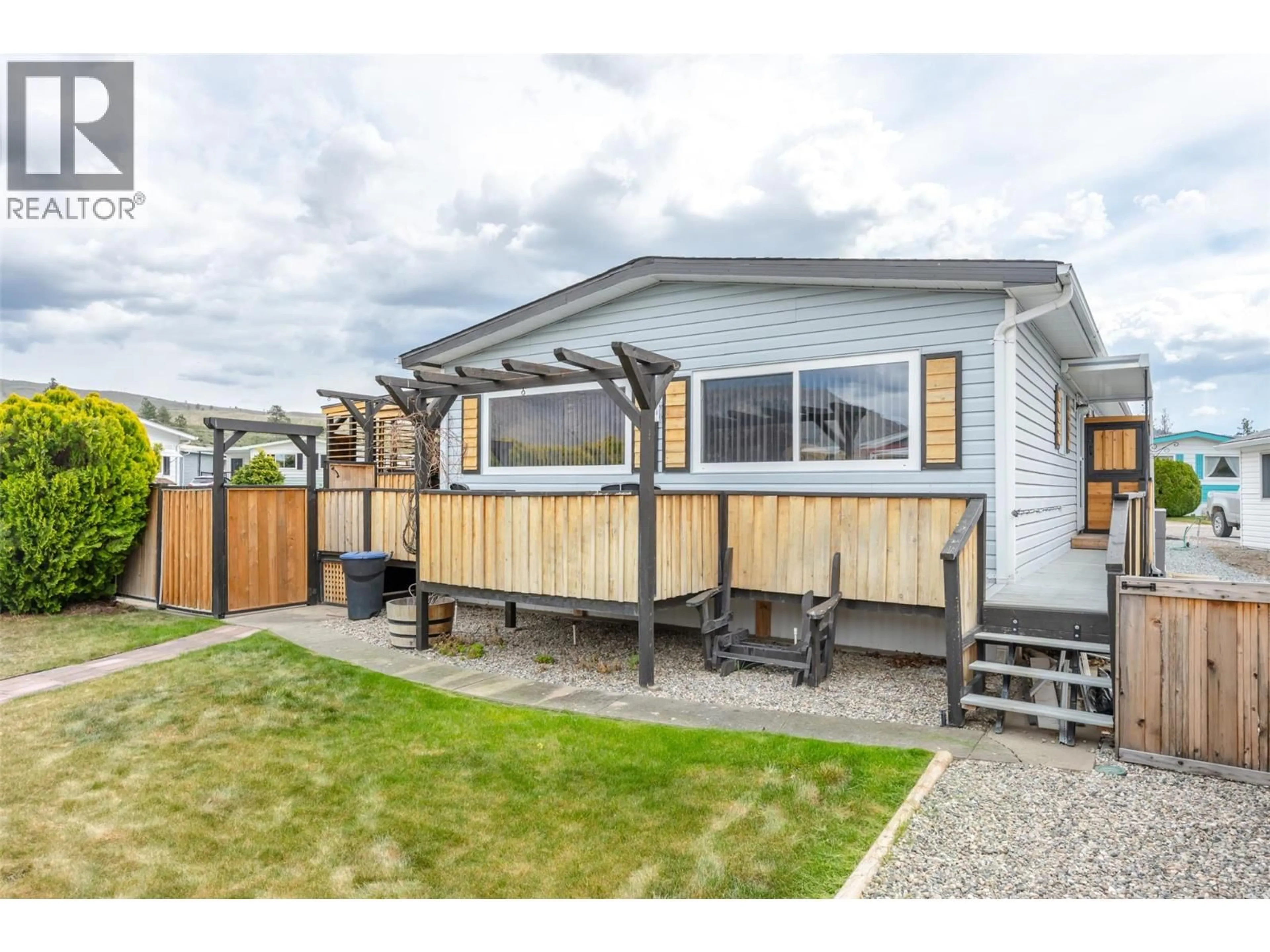 Home with vinyl exterior material, street for 30 - 6601 TUCELNUIT DRIVE, Oliver British Columbia V0H1T3