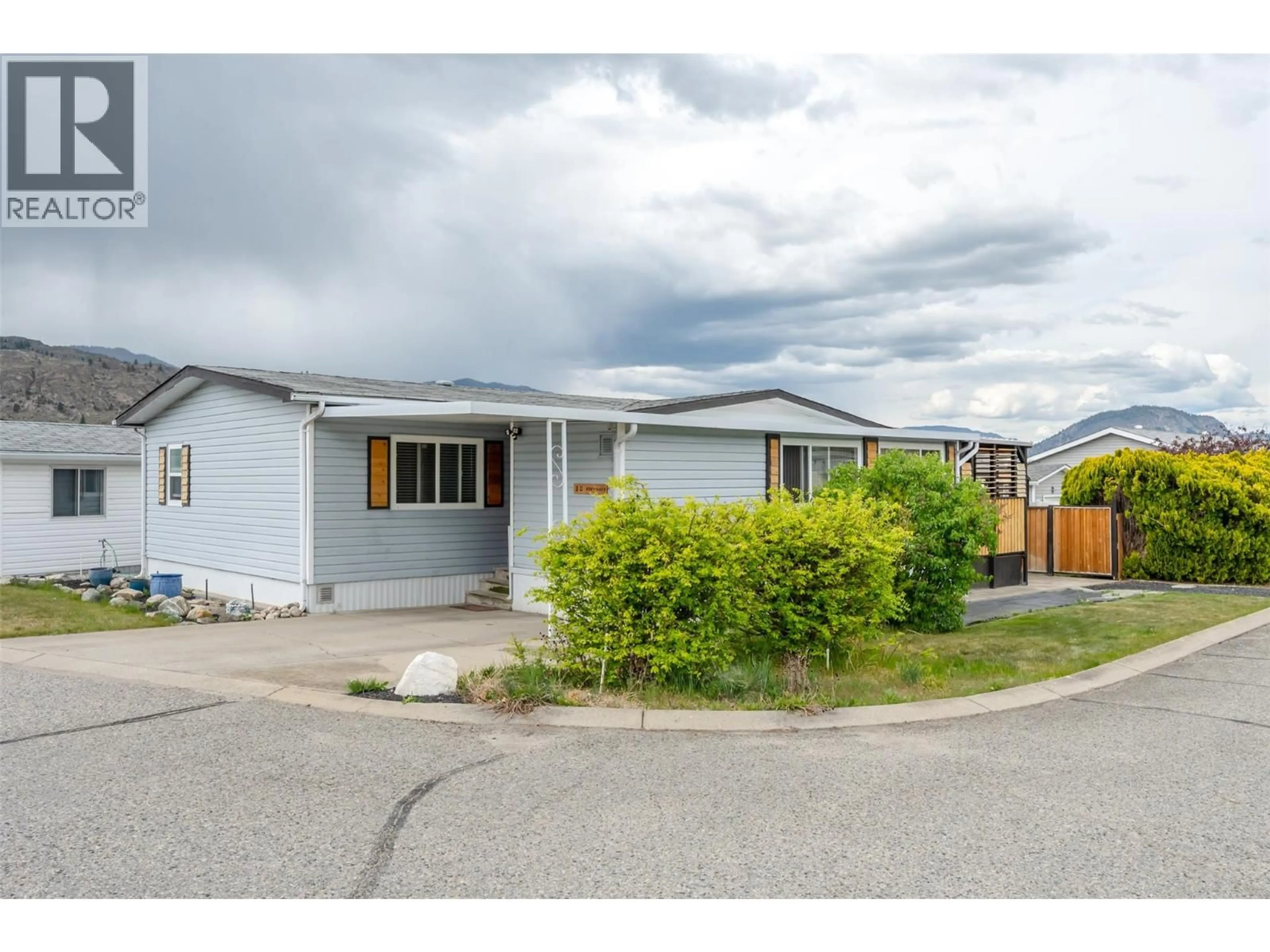 Home with vinyl exterior material, street for 30 - 6601 TUCELNUIT DRIVE, Oliver British Columbia V0H1T3