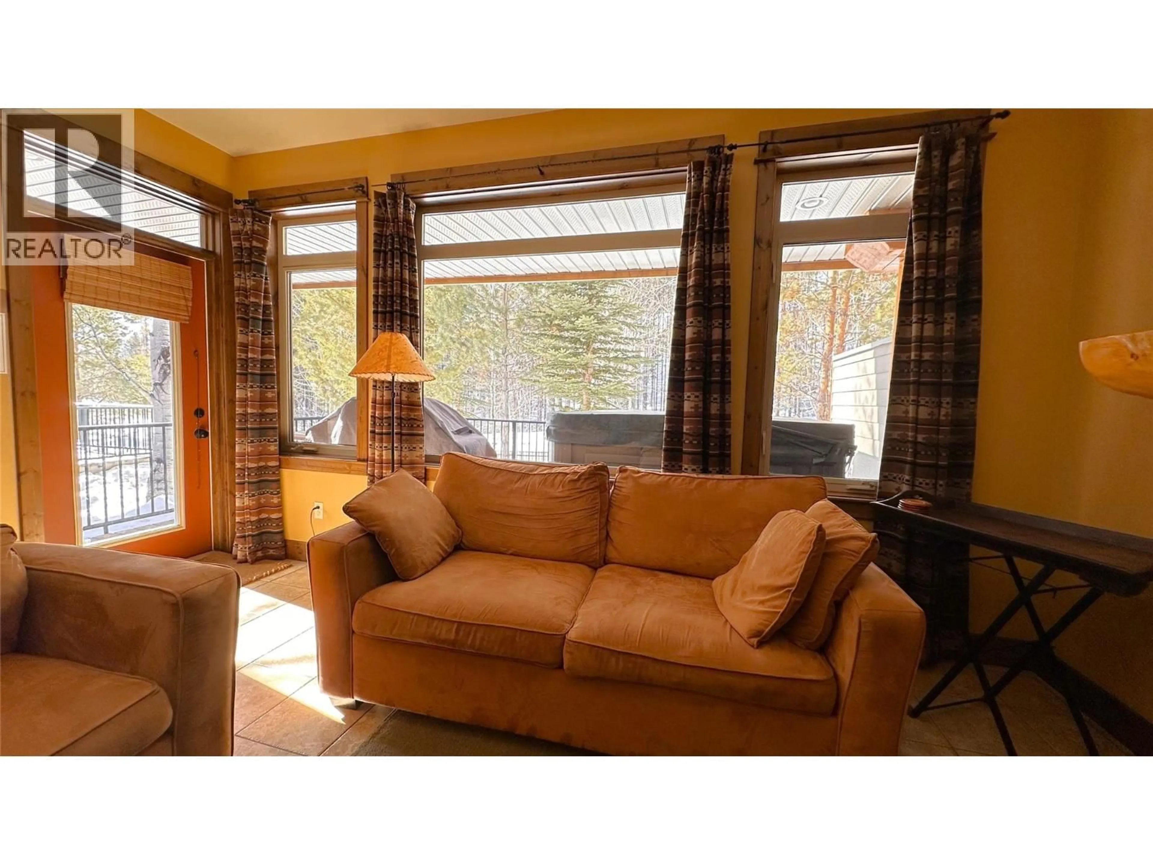 Living room with furniture, wood/laminate floor for M4-D - 1351 GERRY SORENSEN WAY, Kimberley British Columbia V1A2Y6