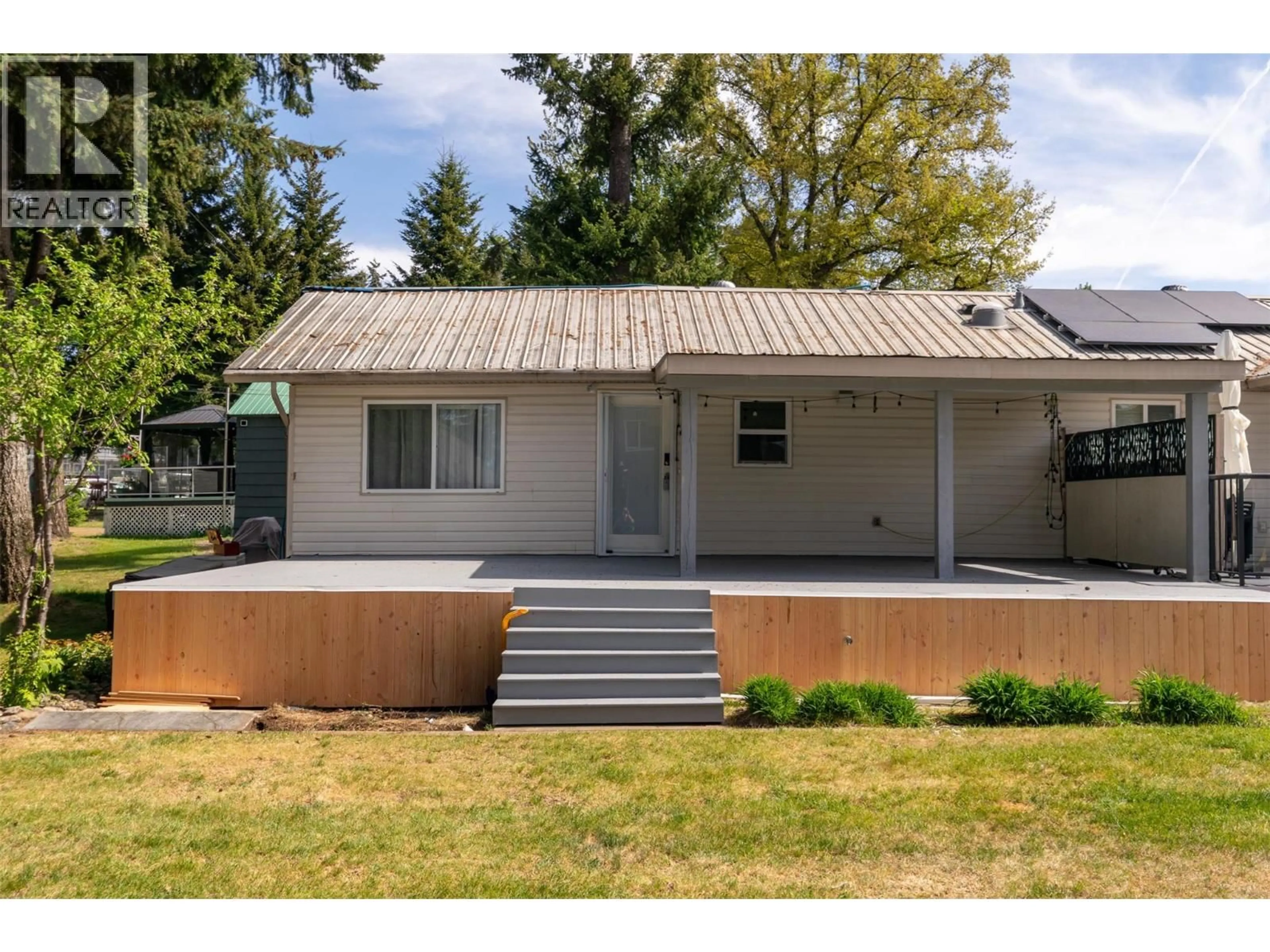 Home with vinyl exterior material, street for 12 - 6924 SQUILAX ANGLEMONT ROAD, Magna Bay British Columbia V0E1M7