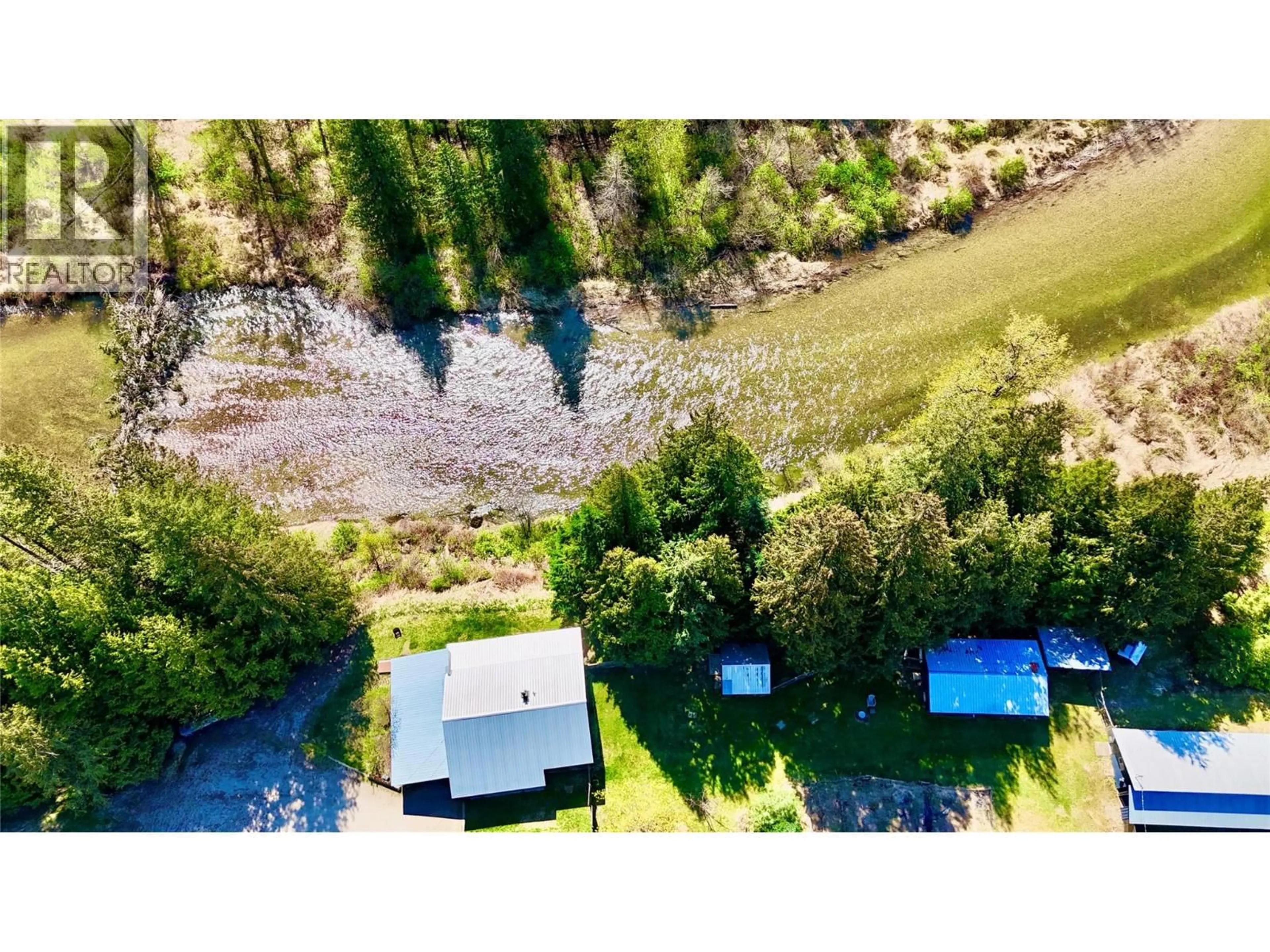 A pic from outside/outdoor area/front of a property/back of a property/a pic from drone, water/lake/river/ocean view for 5704 TRANS CANADA HIGHWAY, Malakwa British Columbia V0E2J0