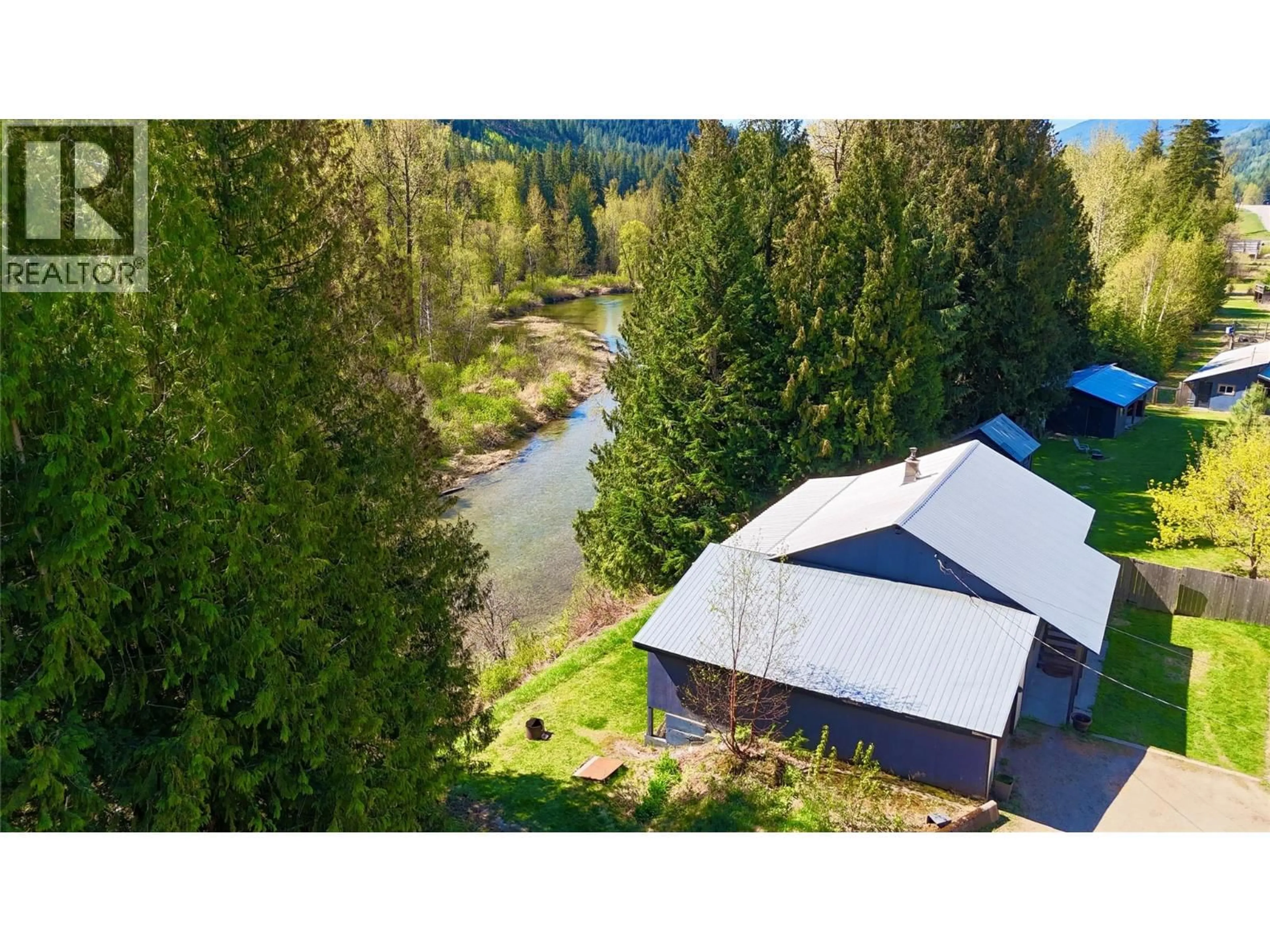 A pic from outside/outdoor area/front of a property/back of a property/a pic from drone, water/lake/river/ocean view for 5704 TRANS CANADA HIGHWAY, Malakwa British Columbia V0E2J0