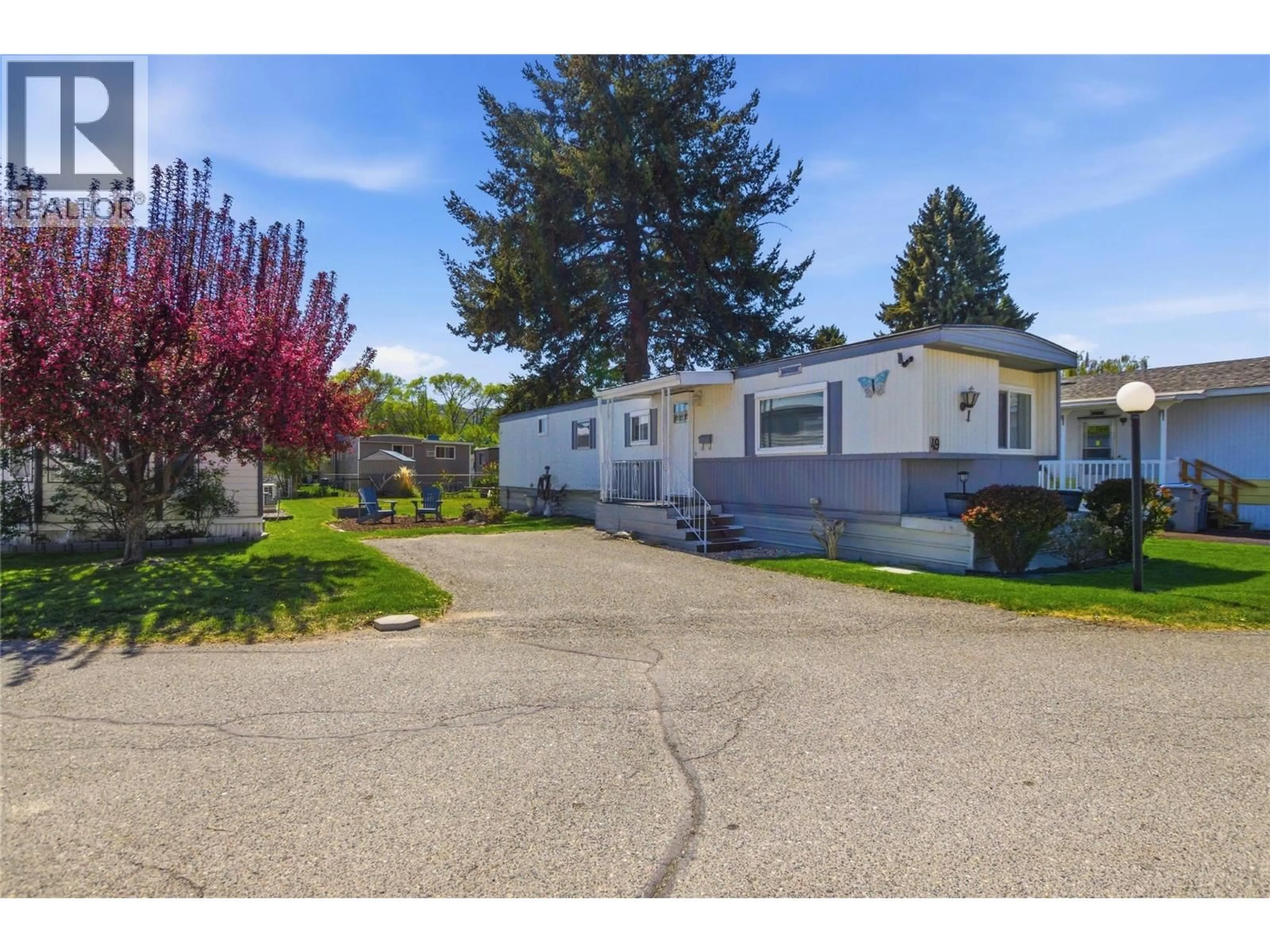 A pic from outside/outdoor area/front of a property/back of a property/a pic from drone, street for 49 - 2401 ORD ROAD, Kamloops British Columbia V2C7V8