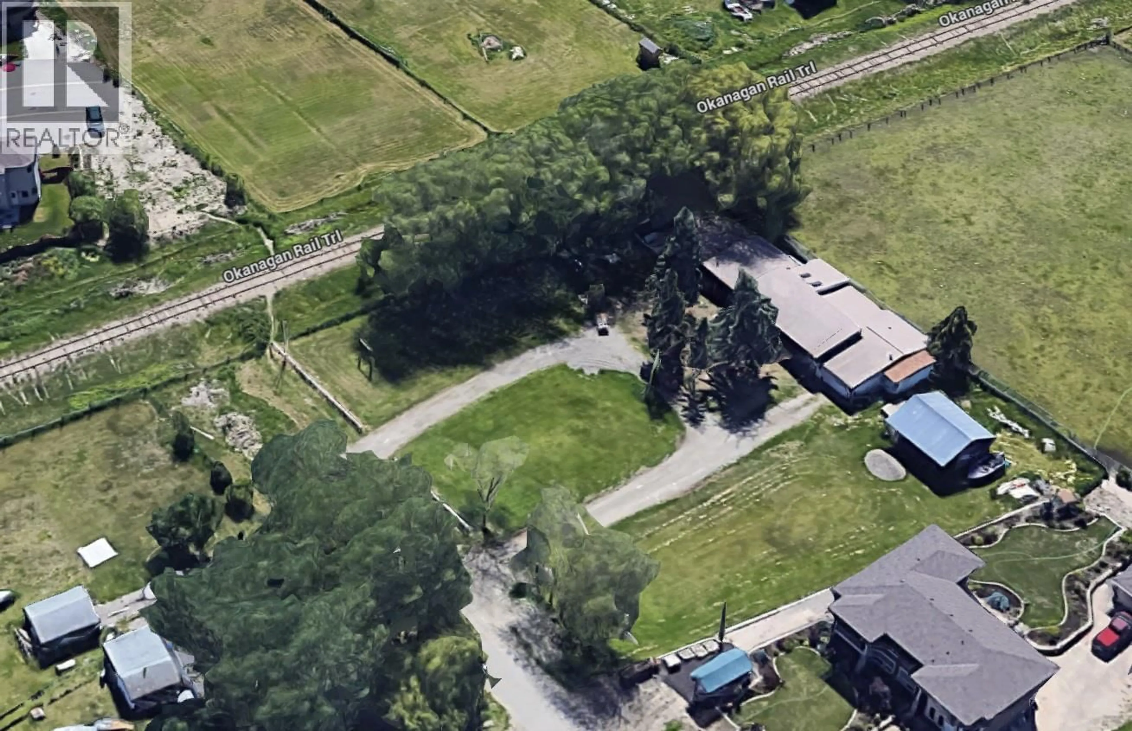 A pic from outside/outdoor area/front of a property/back of a property/a pic from drone, street for 3687 REDECOPP ROAD, Lake Country British Columbia V4V1X5