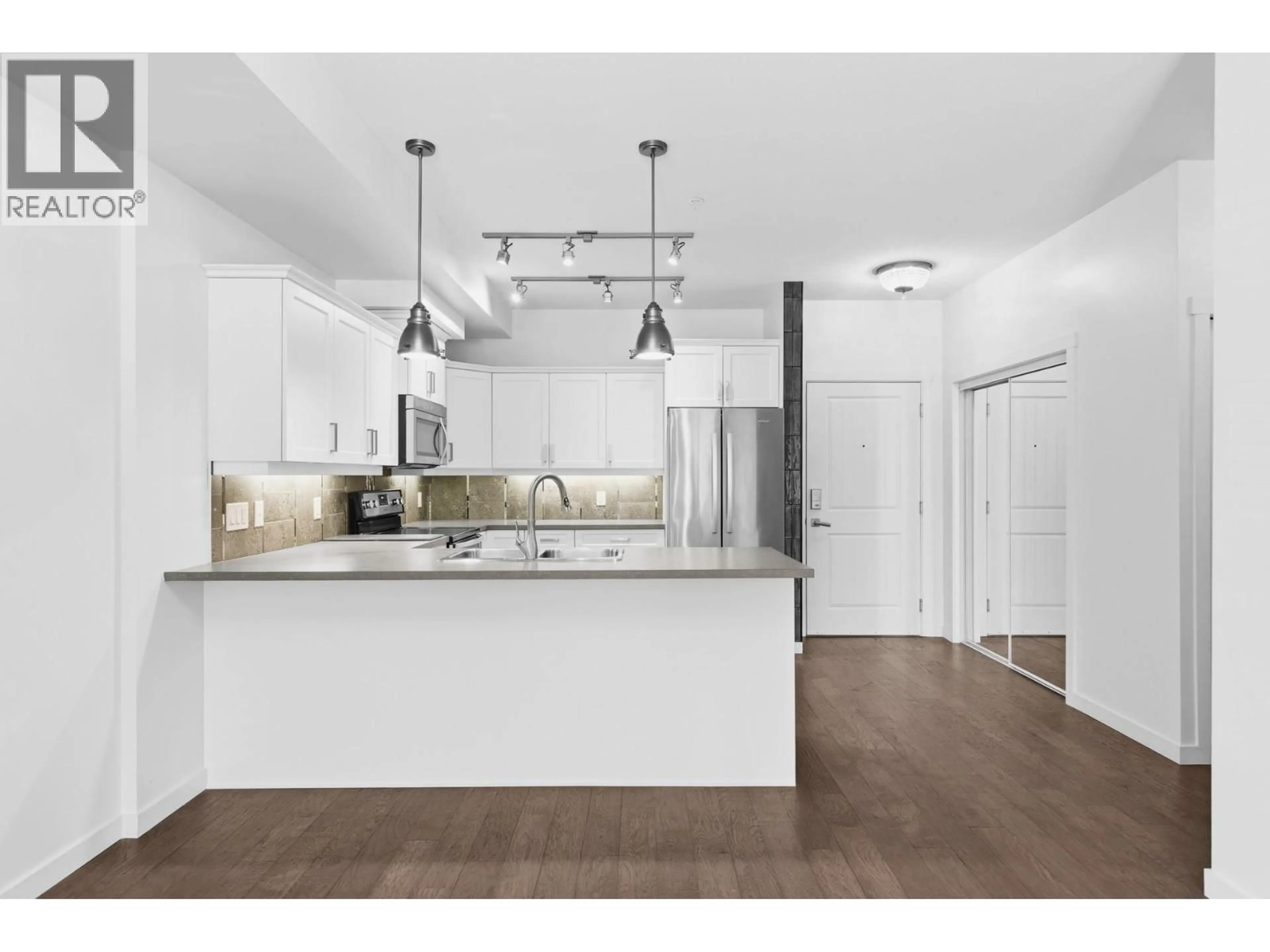 Open concept kitchen, unknown for 103 - 3733 CASORSO ROAD, Kelowna British Columbia V1W5E3