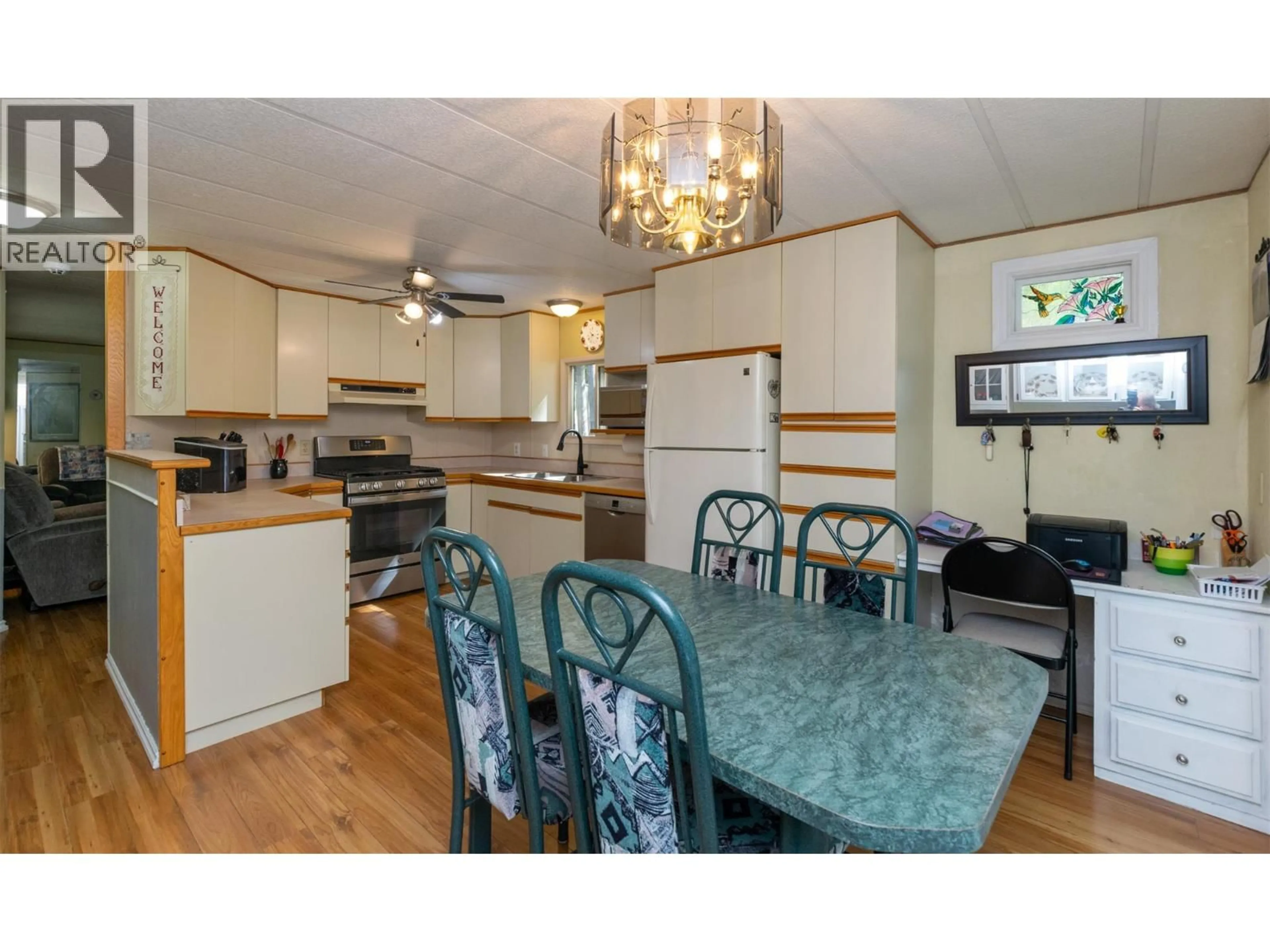 Open concept kitchen, wood/laminate floor for 19 - 5161 63 AVENUE NORTHEAST, Salmon Arm British Columbia V0E1K0