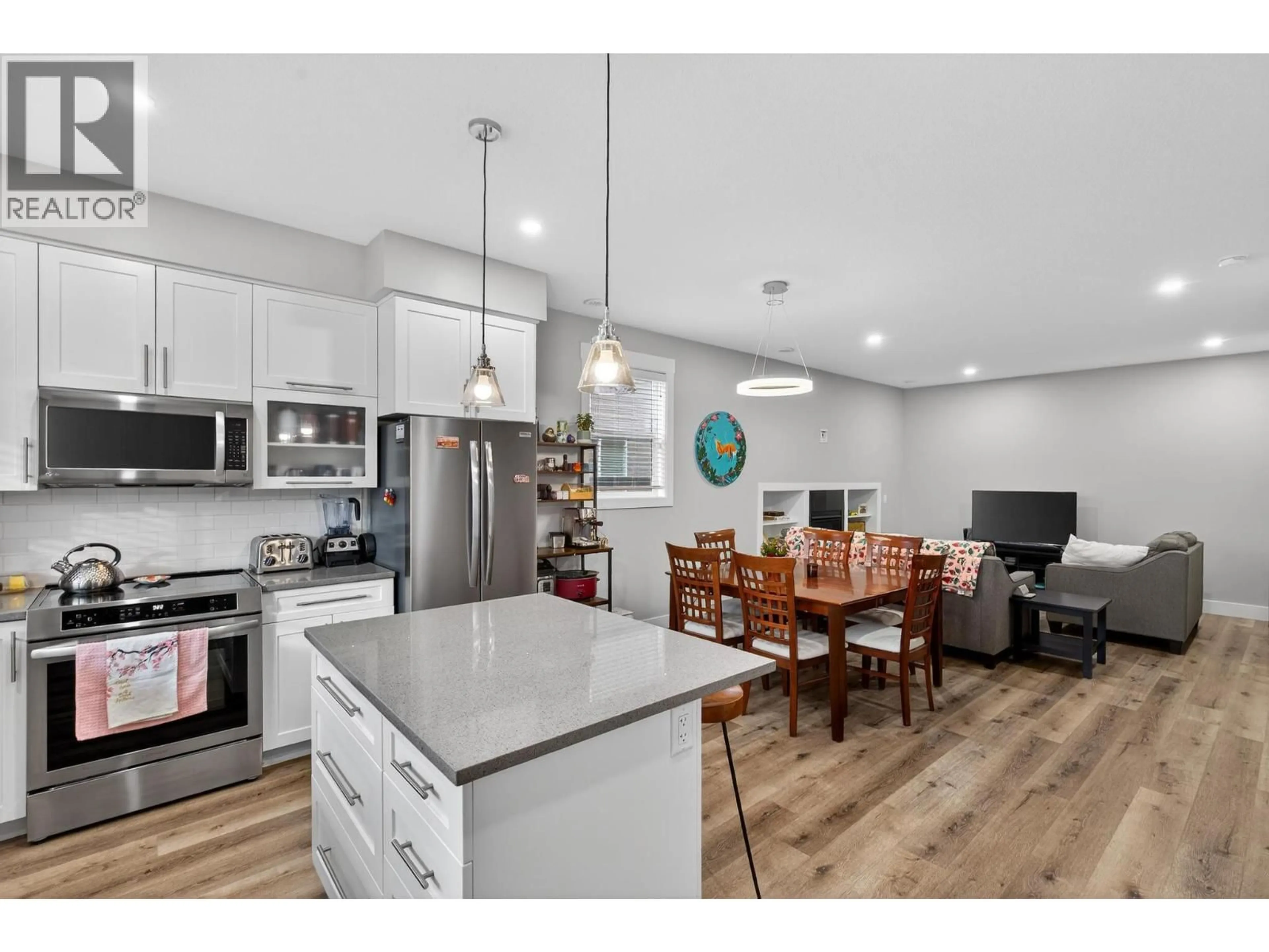 Open concept kitchen, wood/laminate floor for 1930 ETHEL STREET, Kelowna British Columbia V1Y2Z5