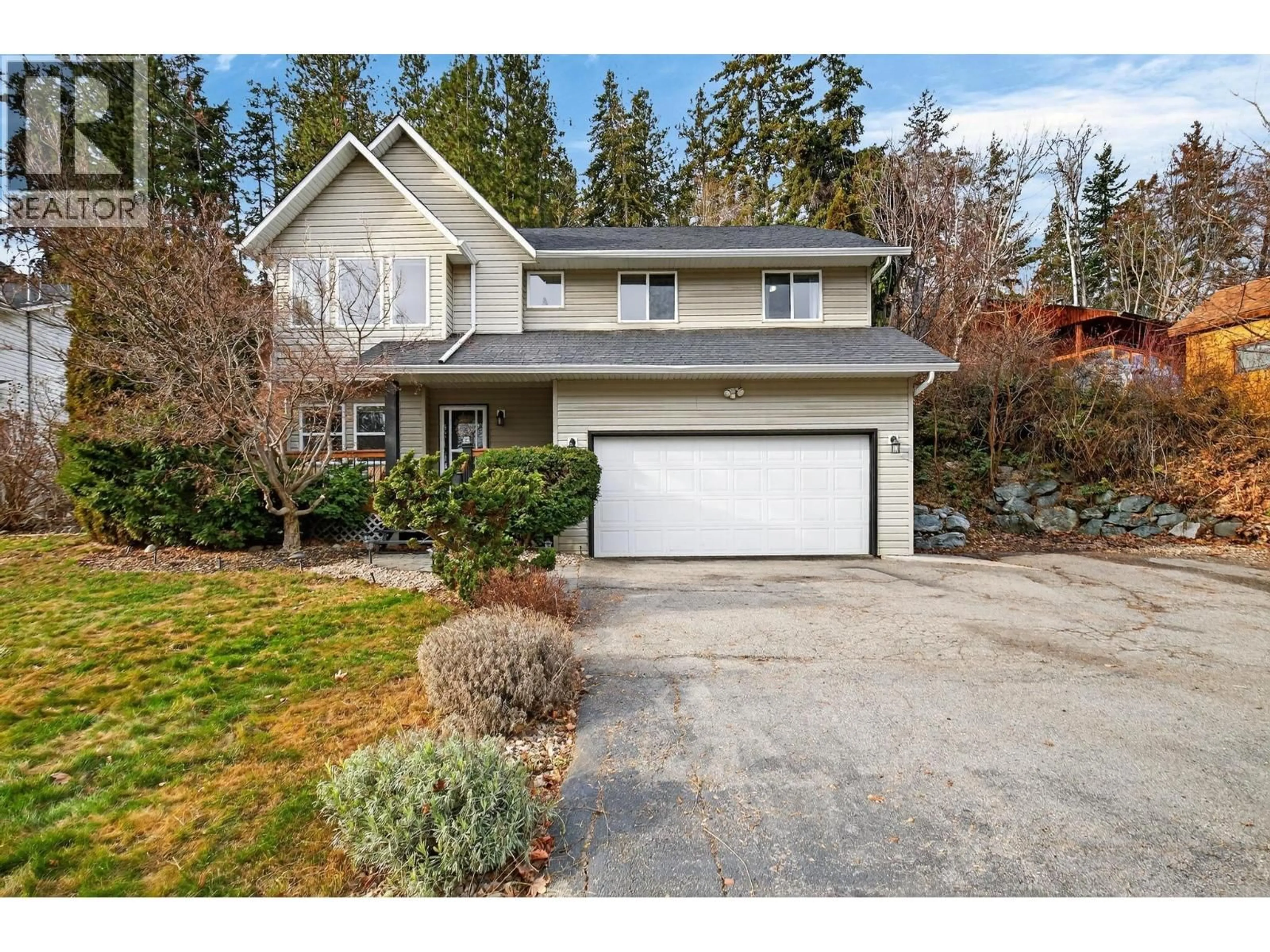 Home with vinyl exterior material, street for 3220 MCIVER ROAD, West Kelowna British Columbia V4T1G1