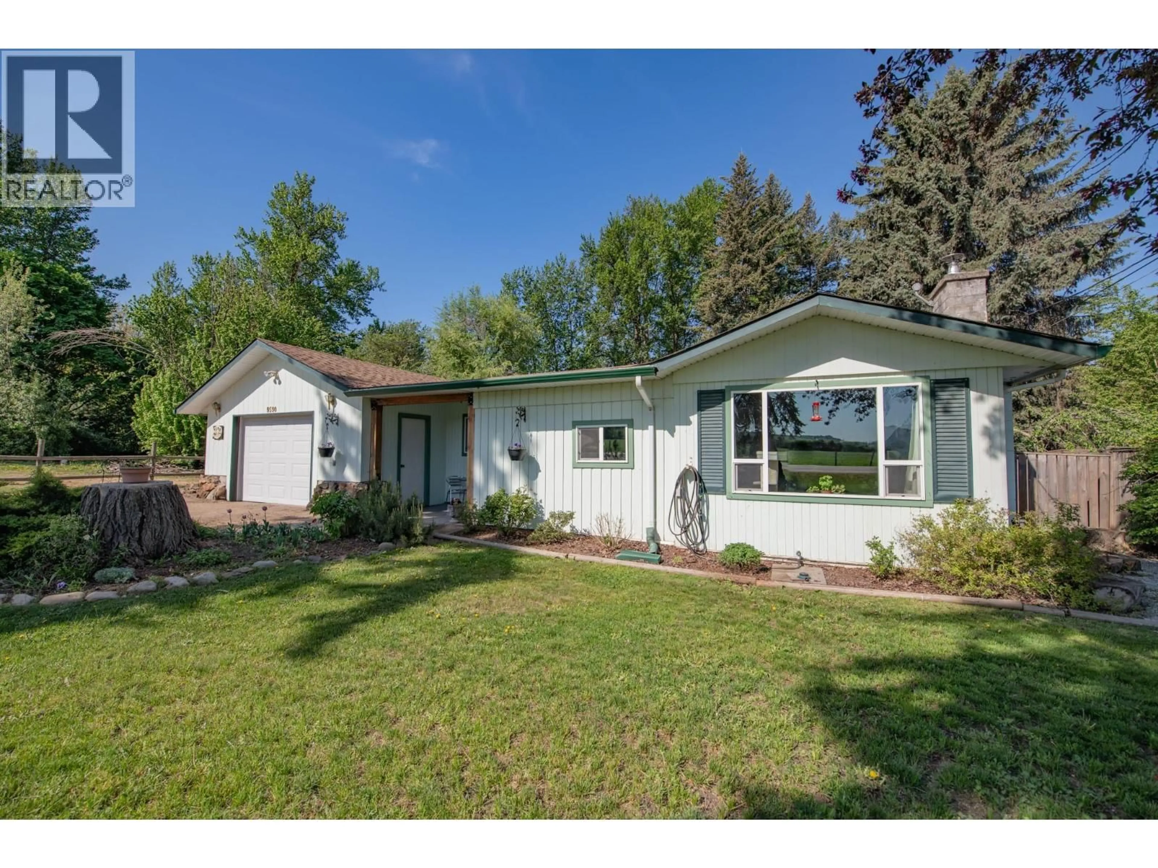 Home with vinyl exterior material, street for 9590 SCHOOL ROAD, Coldstream British Columbia V1B3G4