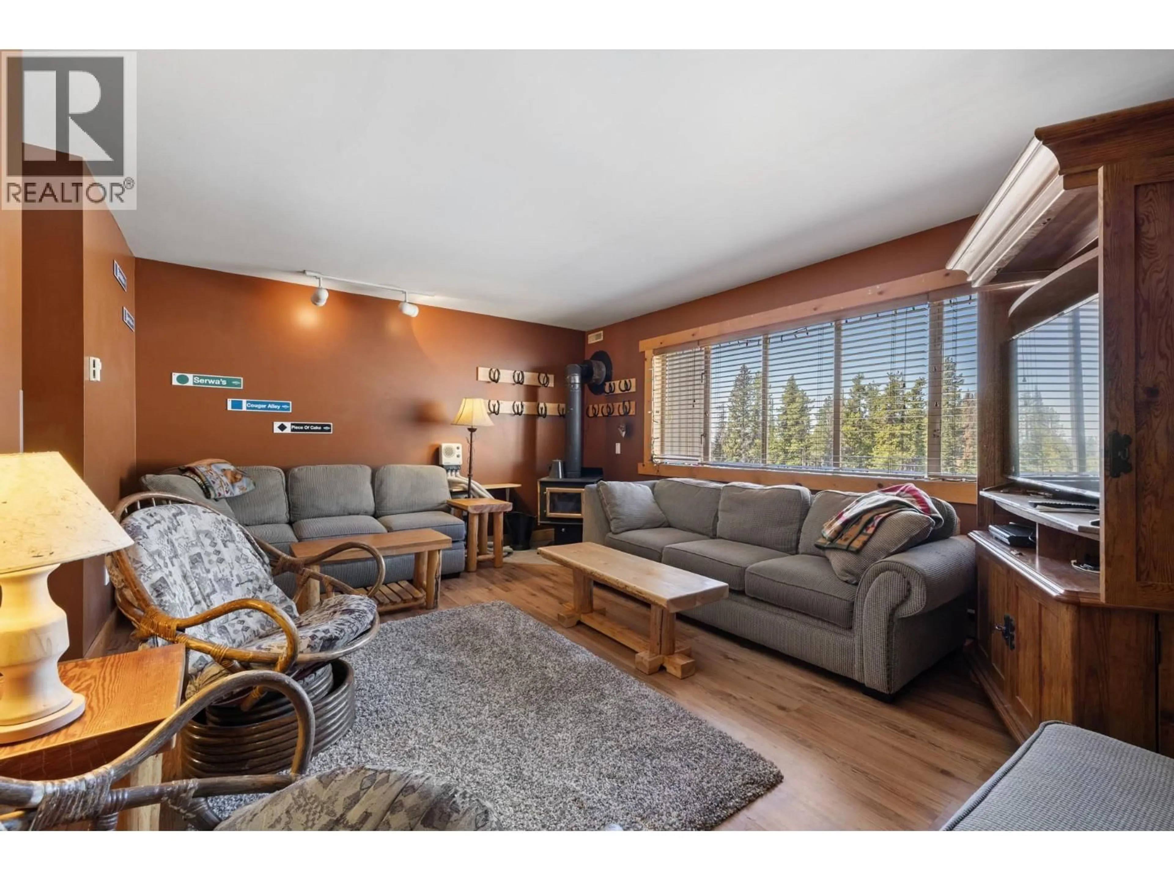 Living room with furniture, wood/laminate floor for B3 - 7375 PORCUPINE ROAD, Big White British Columbia V1P1P3