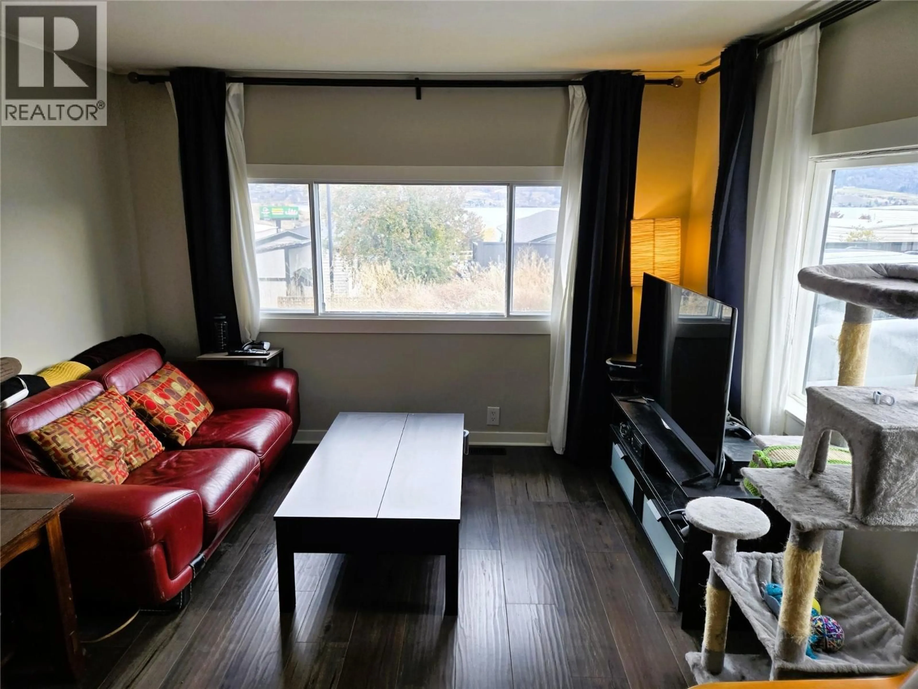 Living room with furniture, wood/laminate floor for 9A RIVA RIDGE ESTATES OTHER, Penticton British Columbia V2A6J7