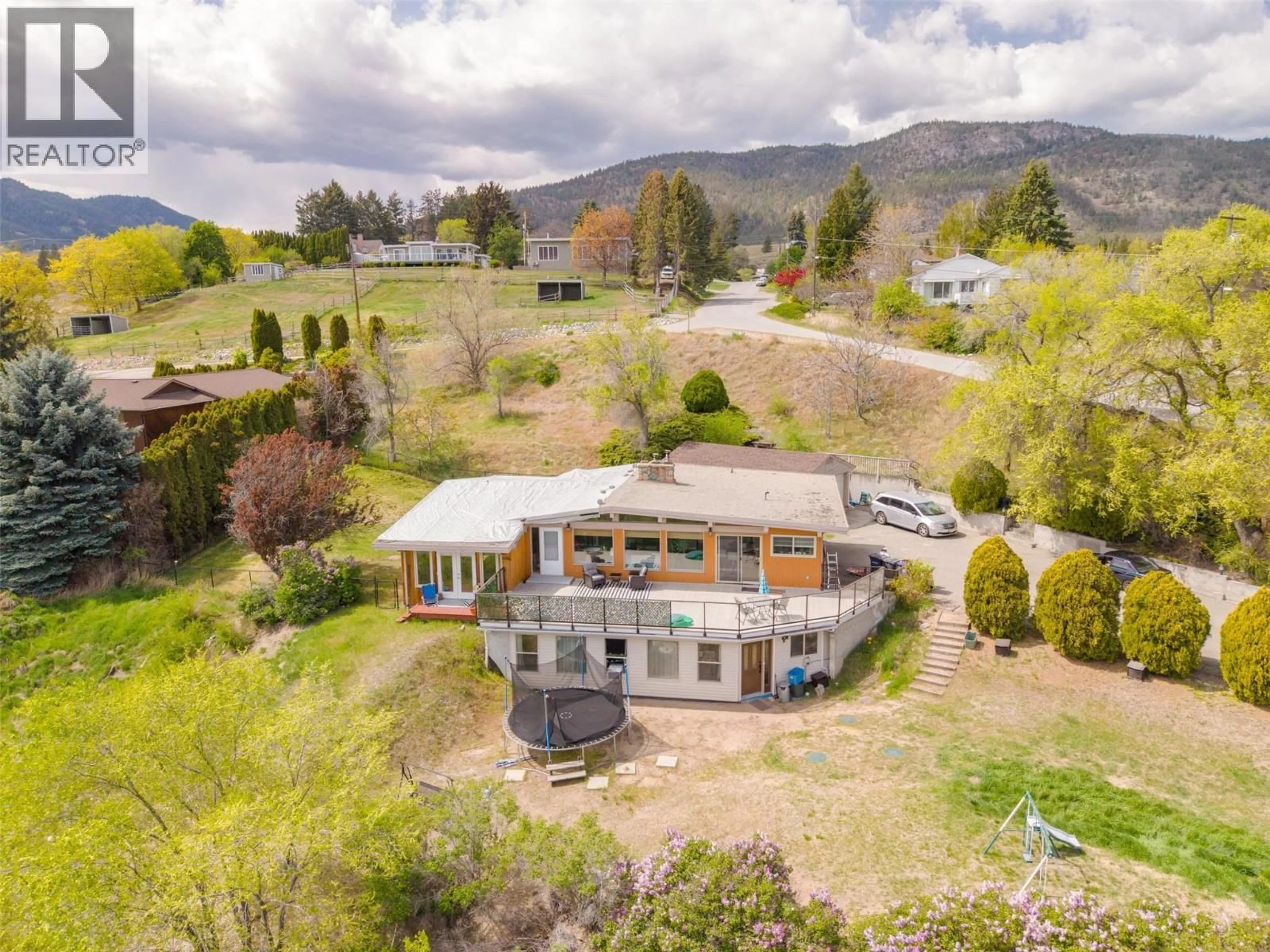 A pic from outside/outdoor area/front of a property/back of a property/a pic from drone, mountain view for 311 SUNGLO DRIVE, Penticton British Columbia V2A8X6