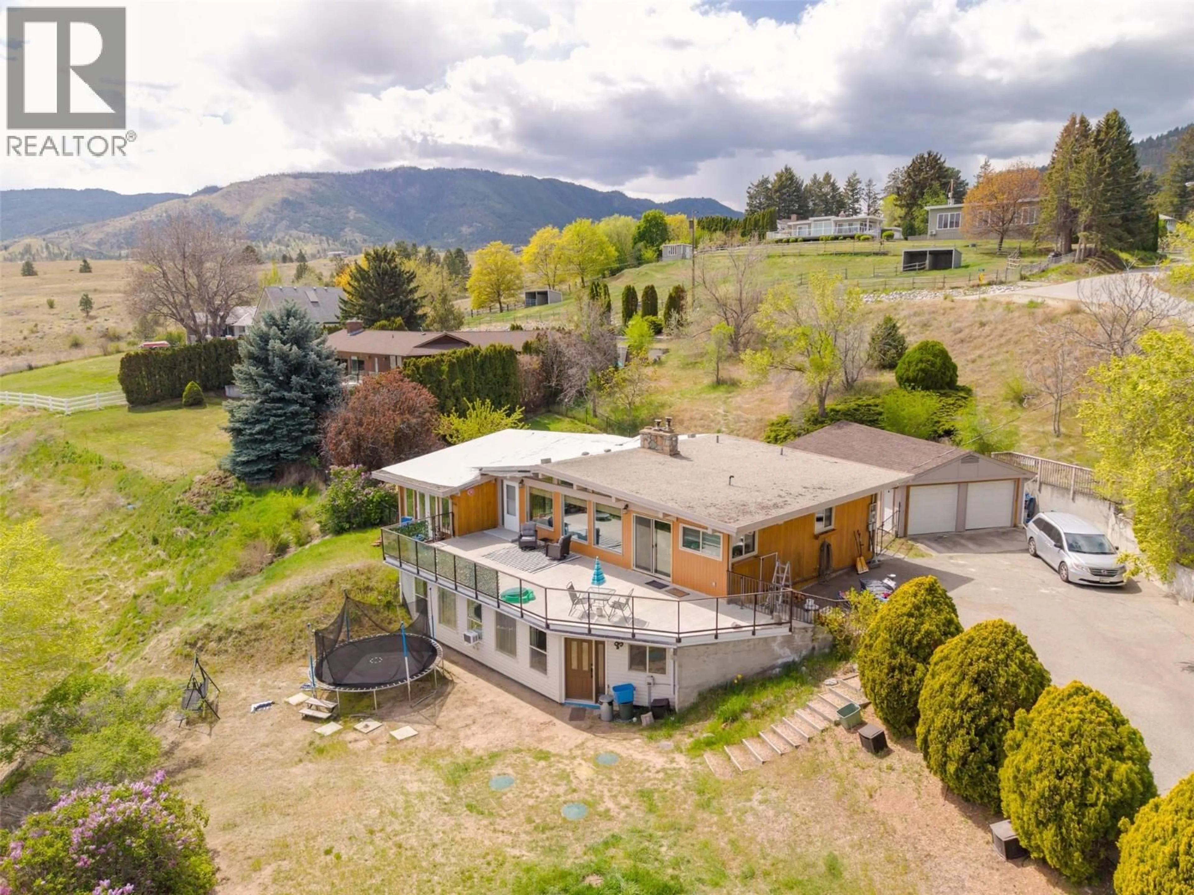A pic from outside/outdoor area/front of a property/back of a property/a pic from drone, mountain view for 311 SUNGLO DRIVE, Penticton British Columbia V2A8X6