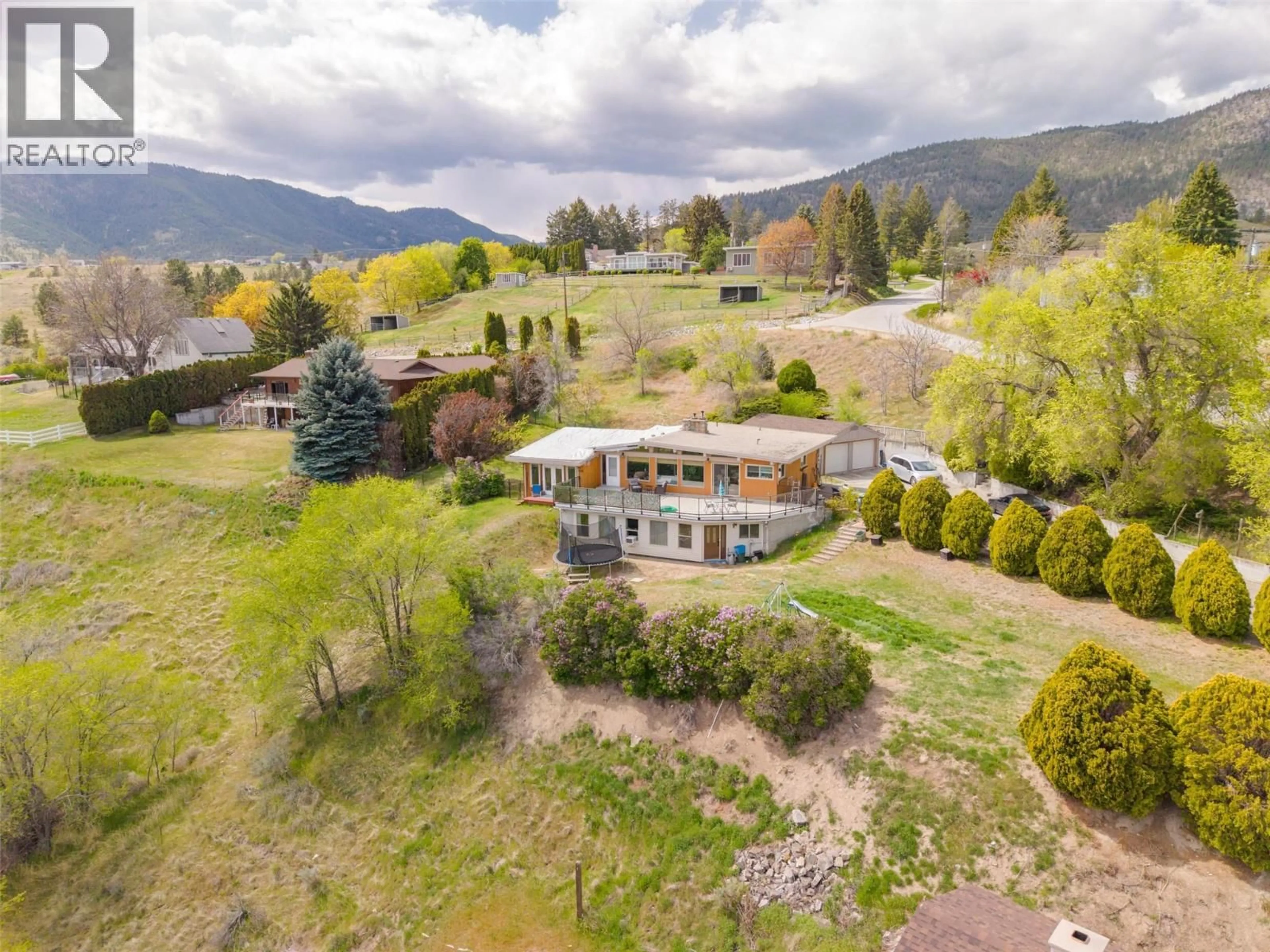 A pic from outside/outdoor area/front of a property/back of a property/a pic from drone, mountain view for 311 SUNGLO DRIVE, Penticton British Columbia V2A8X6