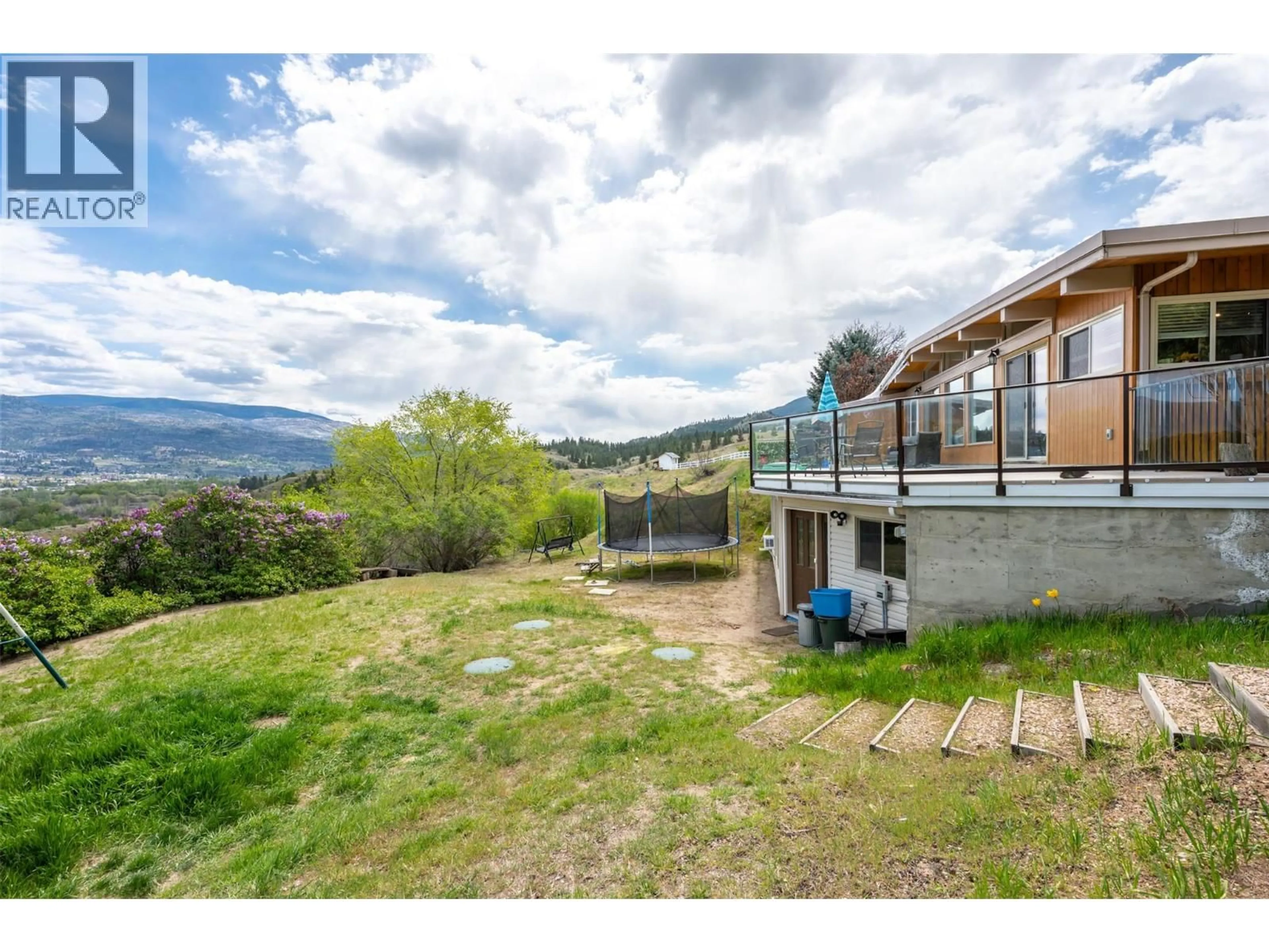 A pic from outside/outdoor area/front of a property/back of a property/a pic from drone, mountain view for 311 SUNGLO DRIVE, Penticton British Columbia V2A8X6