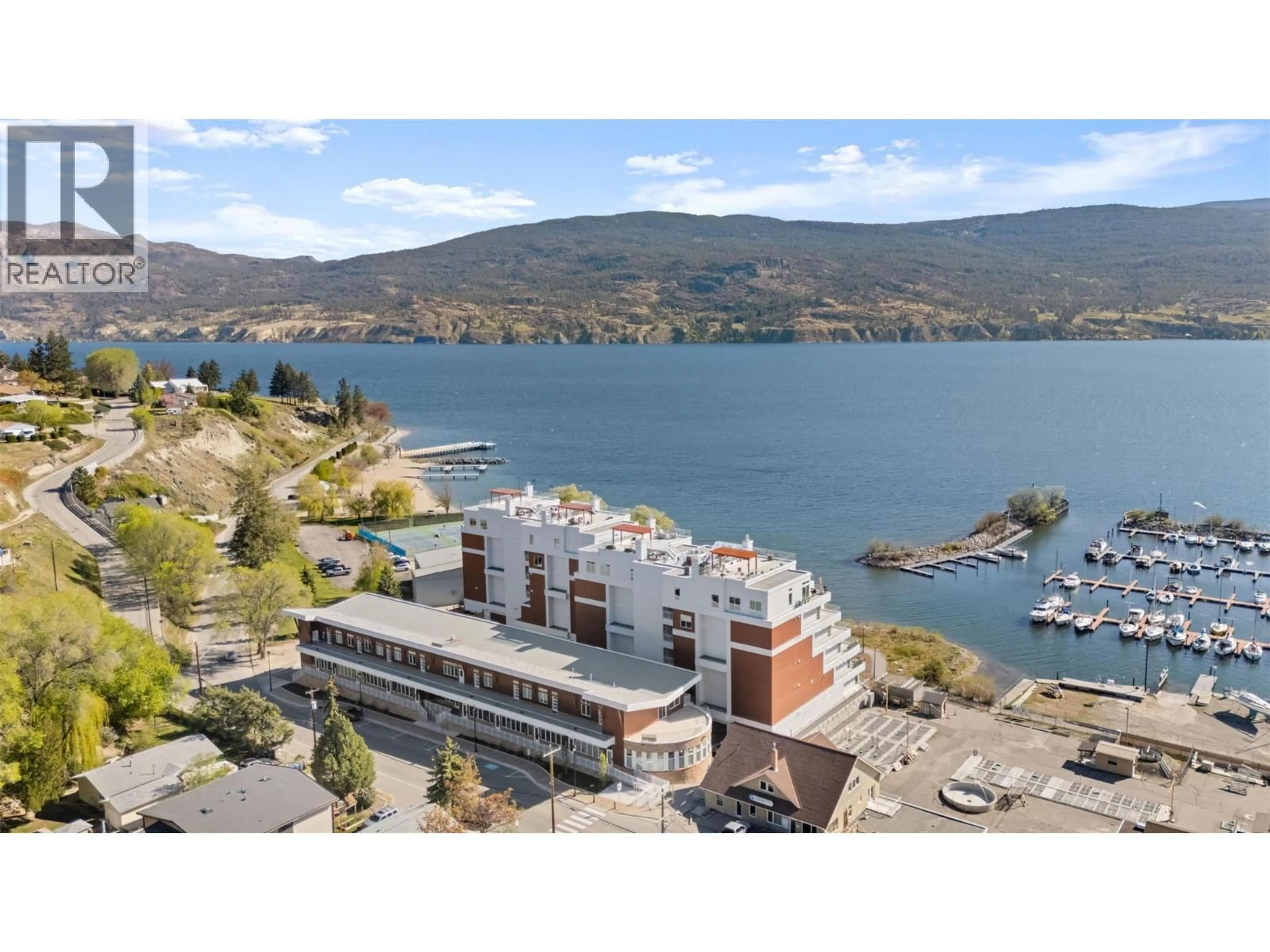 A pic from outside/outdoor area/front of a property/back of a property/a pic from drone, water/lake/river/ocean view for 207 - 13417 LAKESHORE DRIVE SOUTH, Summerland British Columbia V0H1Z1