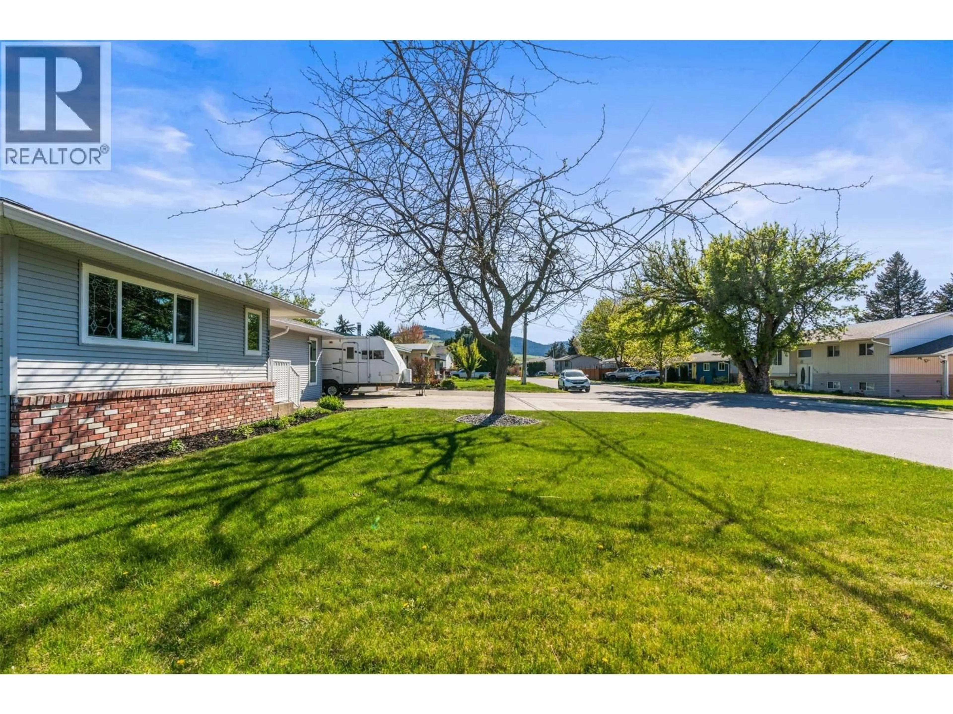 A pic from outside/outdoor area/front of a property/back of a property/a pic from drone, street for 1313 43RD STREET, Vernon British Columbia V1T7R7