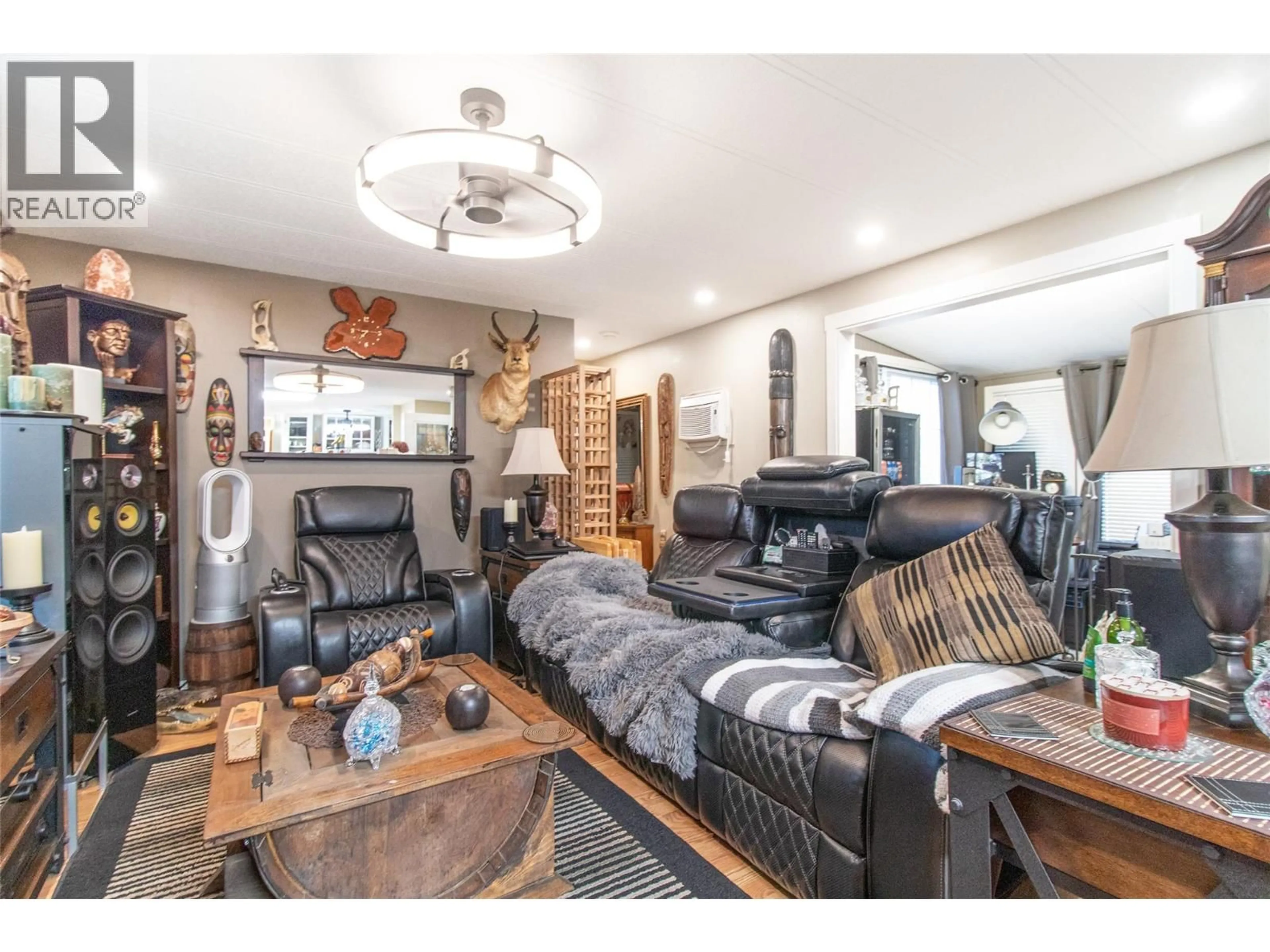 Living room with furniture, wood/laminate floor for 167 - 1880 OLD BOUCHERIE ROAD, Westbank British Columbia V4T1Z3