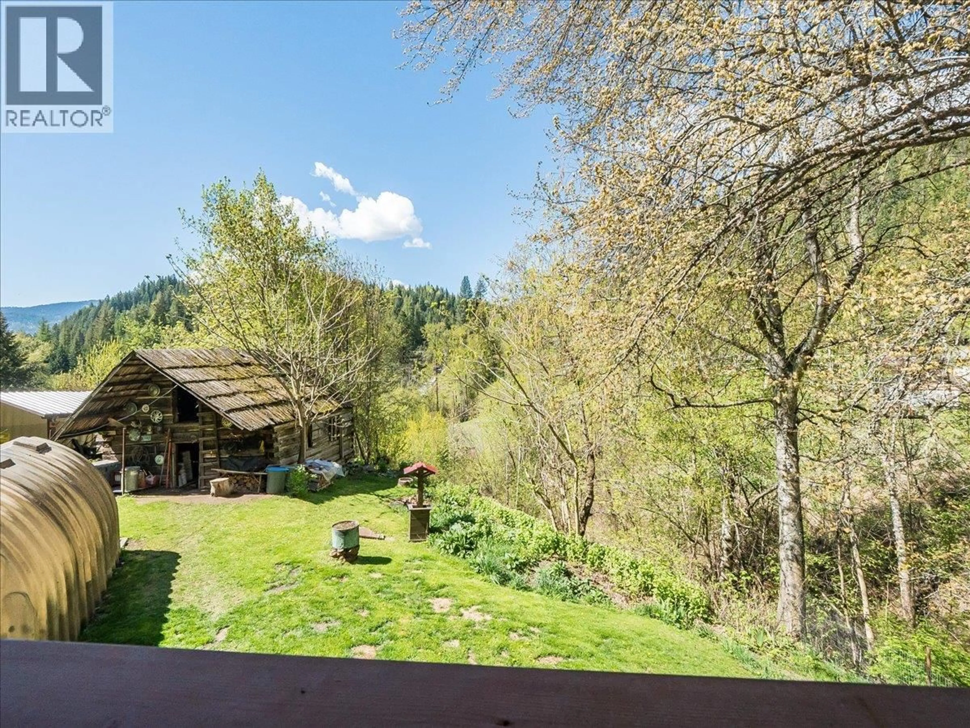 A pic from outside/outdoor area/front of a property/back of a property/a pic from drone, forest/trees view for 1448 PASS CREEK ROAD, Castlegar British Columbia V1N4S2