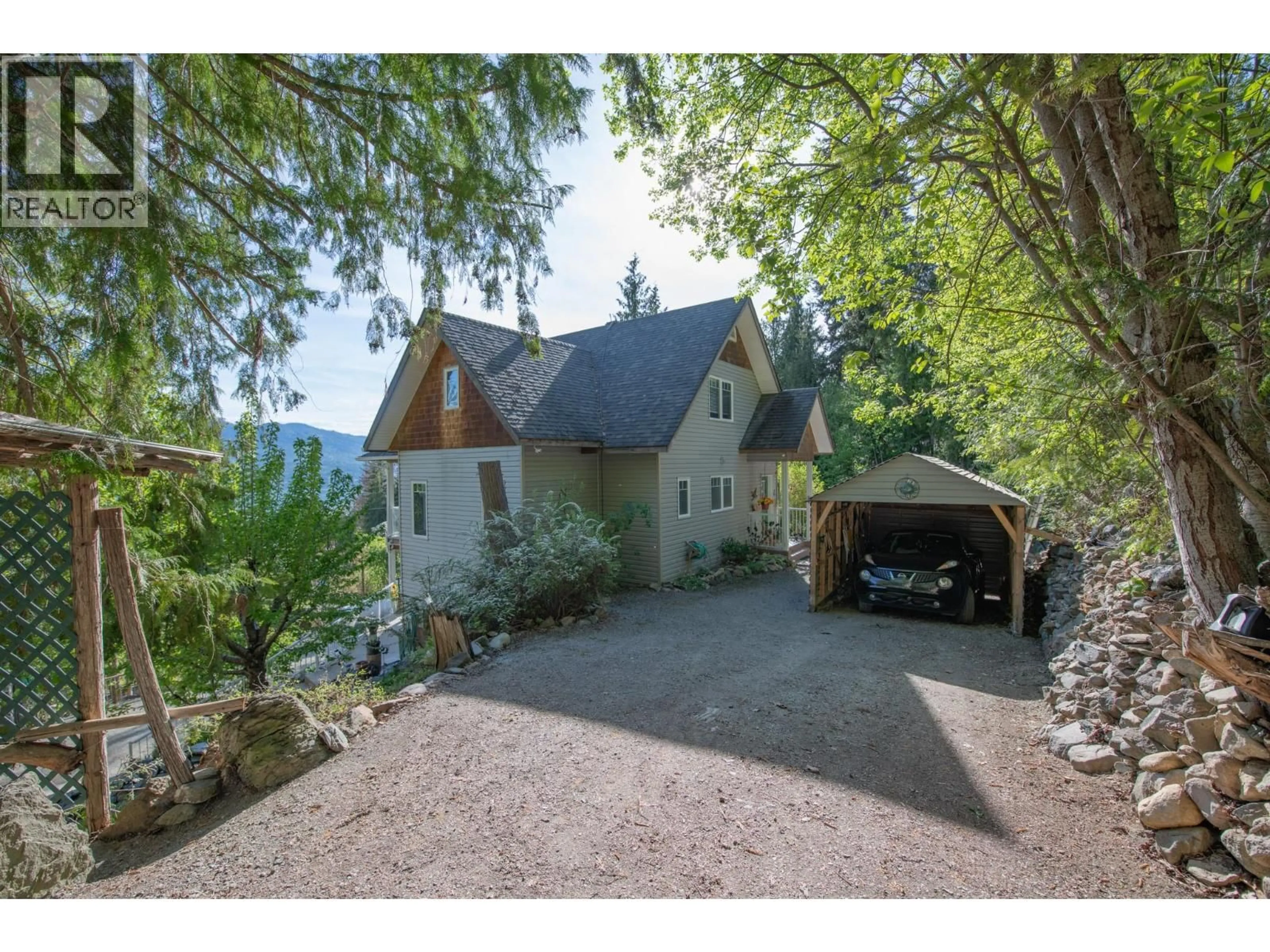 A pic from outside/outdoor area/front of a property/back of a property/a pic from drone, street for 7531 LONNEKE TRAIL, Anglemont British Columbia V0E1M8