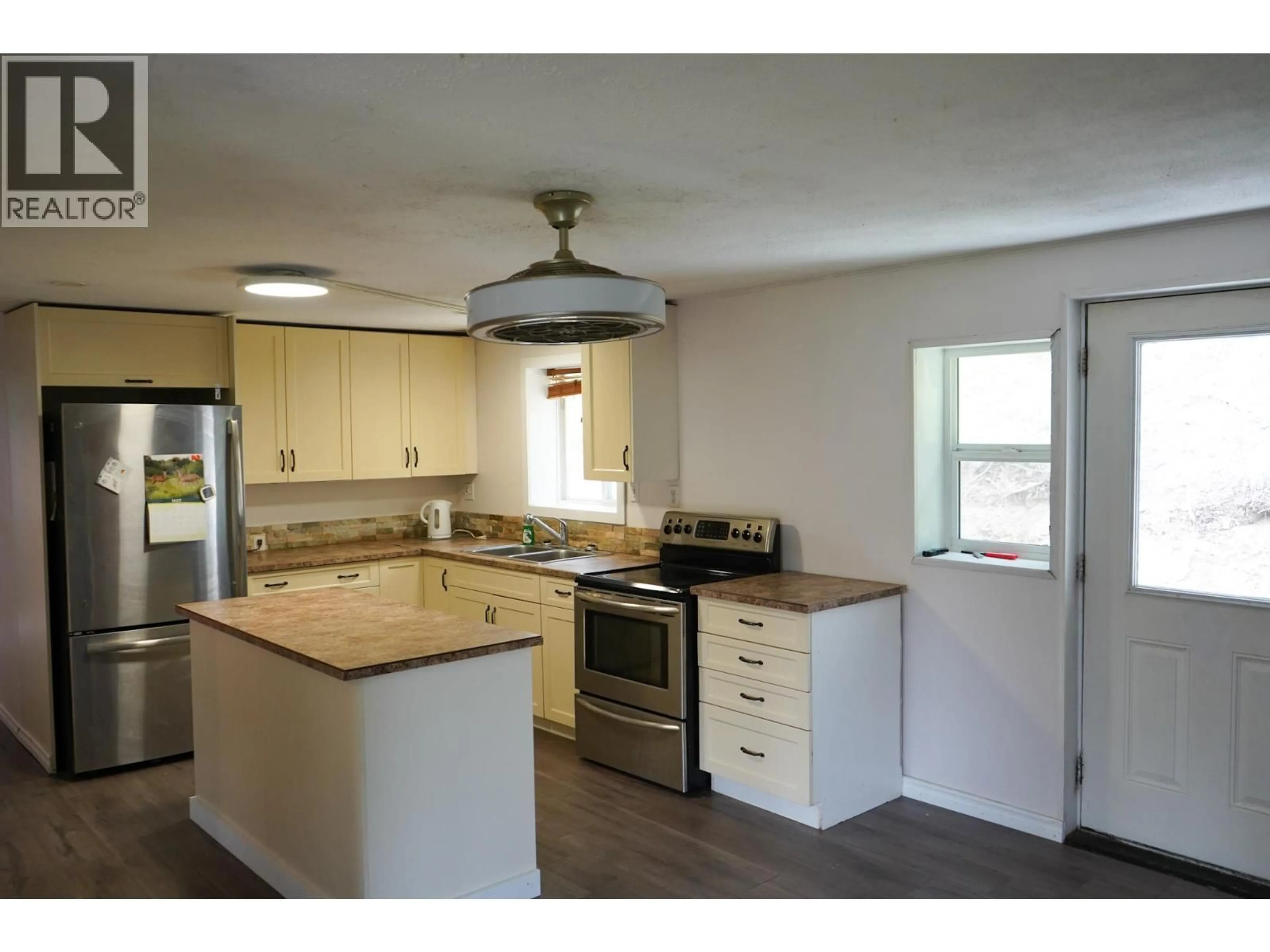 Open concept kitchen, wood/laminate floor for 1741 CHASM ROAD, Clinton British Columbia V0K1K0