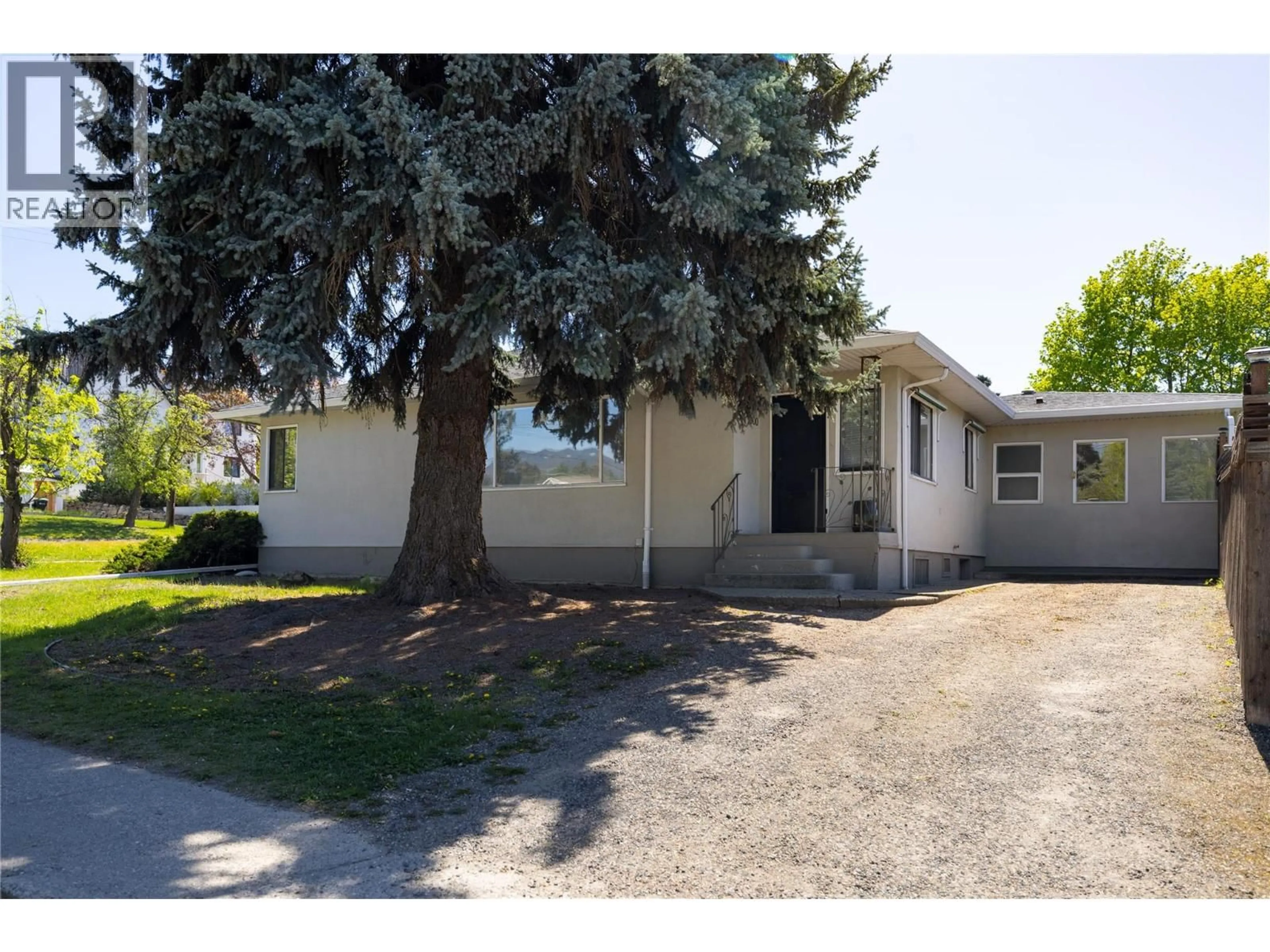 Home with vinyl exterior material, street for 1900 37 AVENUE, Vernon British Columbia V1T2W8