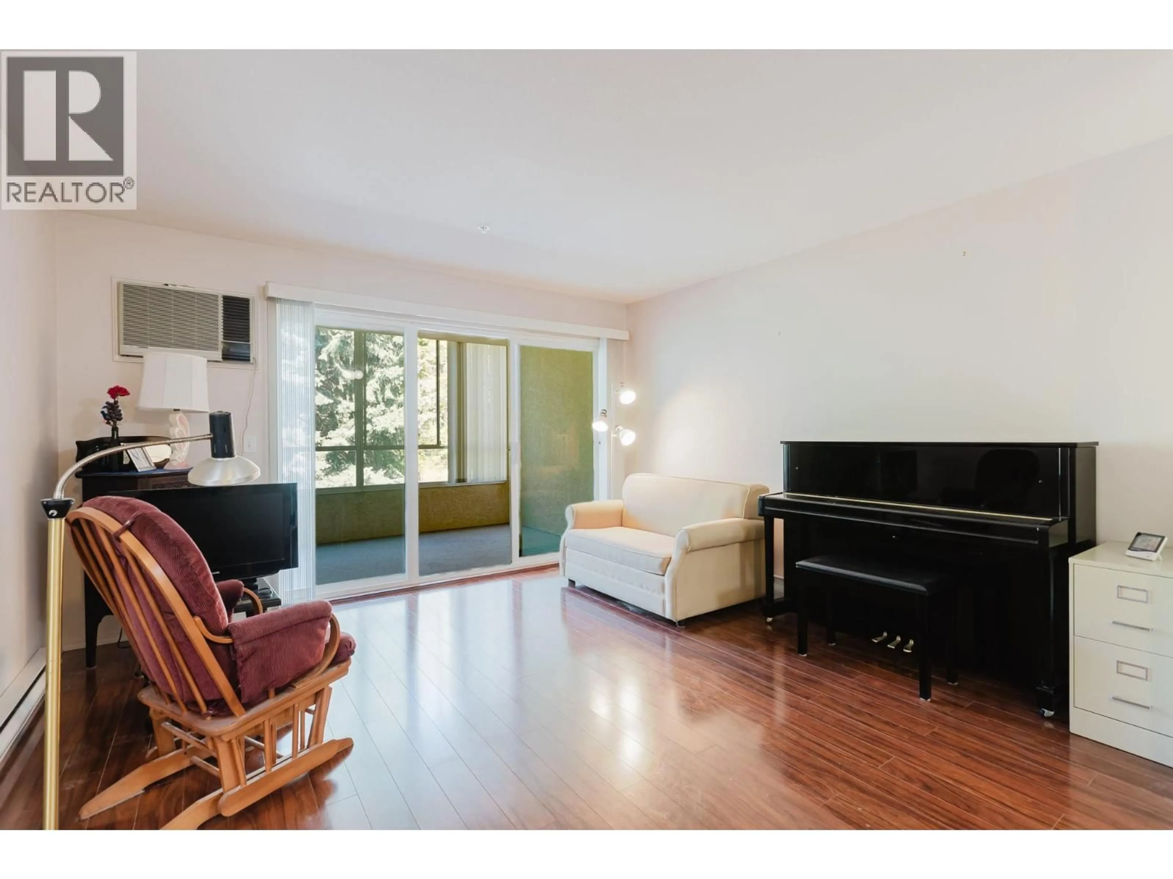 Living room with furniture, wood/laminate floor for 205 - 920 SASKATOON ROAD, Kelowna British Columbia V1X7P8