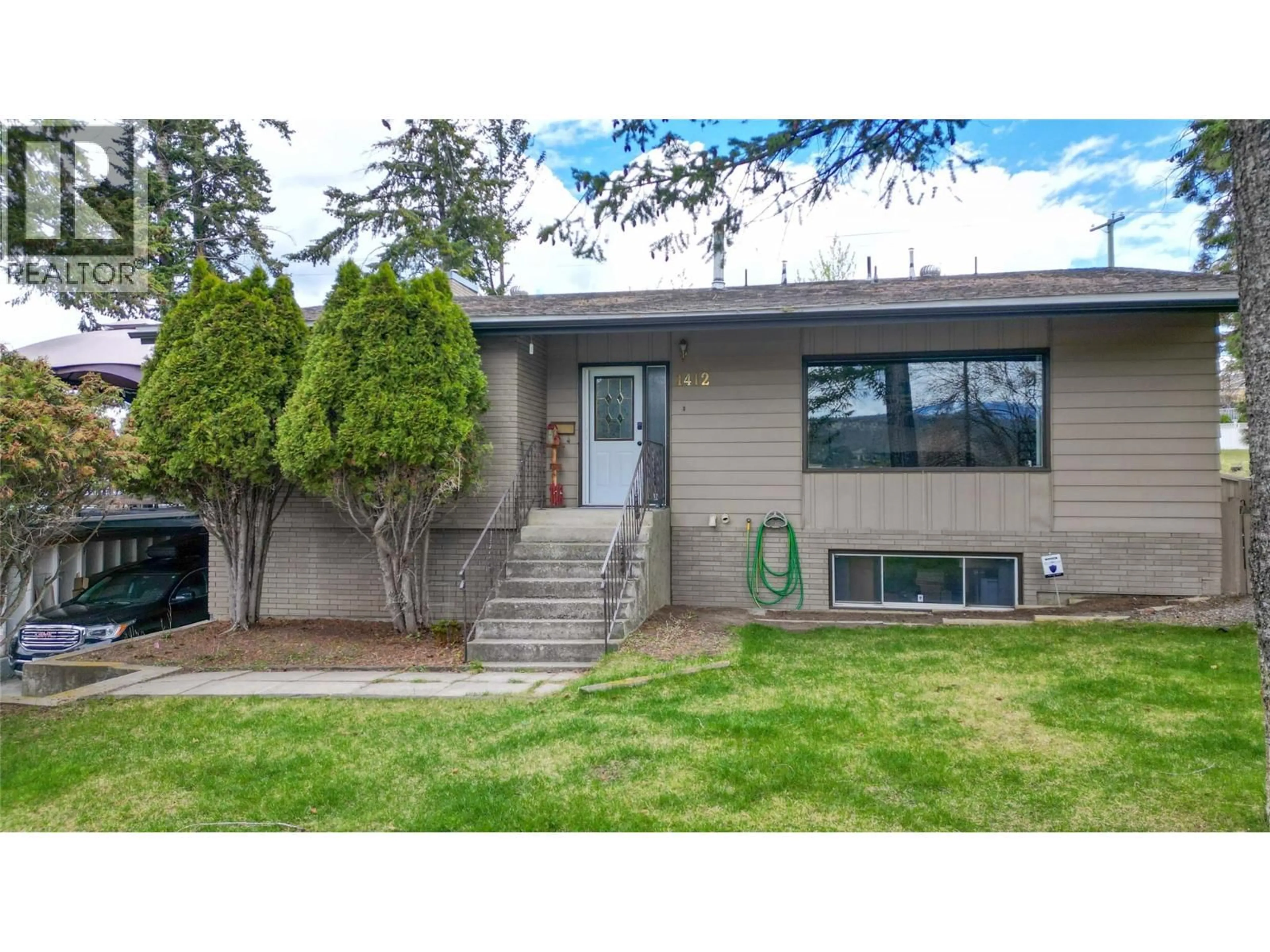 Home with vinyl exterior material, street for 1412 3RD AVENUE SOUTH, Cranbrook British Columbia V1C2C8