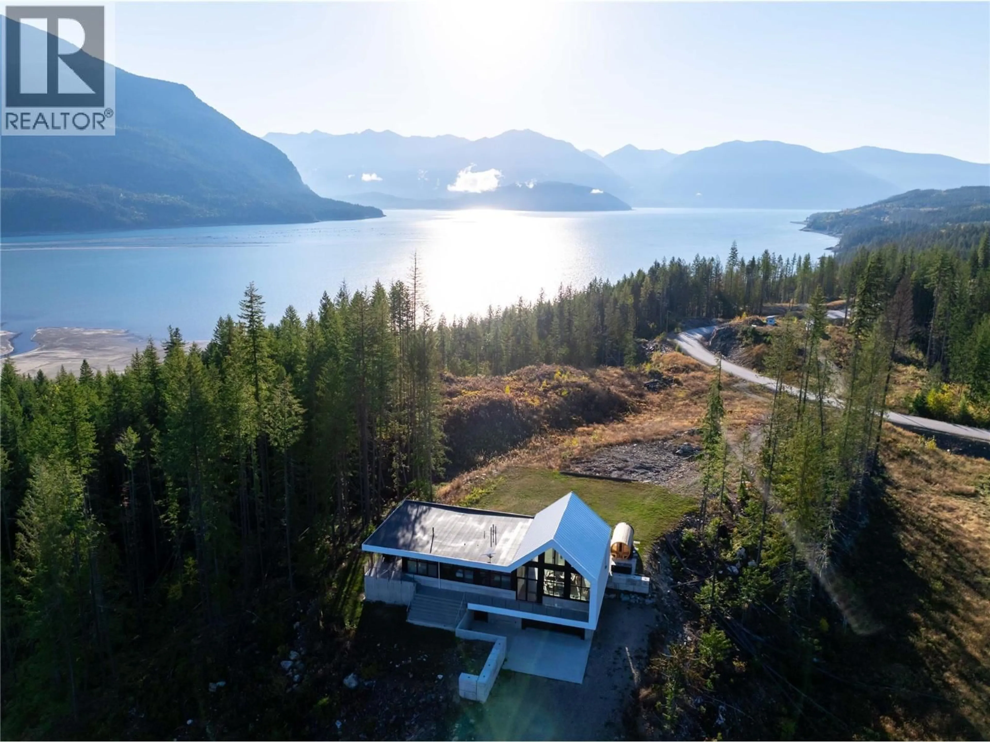 A pic from outside/outdoor area/front of a property/back of a property/a pic from drone, water/lake/river/ocean view for 1950 SIDMOUTH ROAD, Revelstoke British Columbia V0E2S0