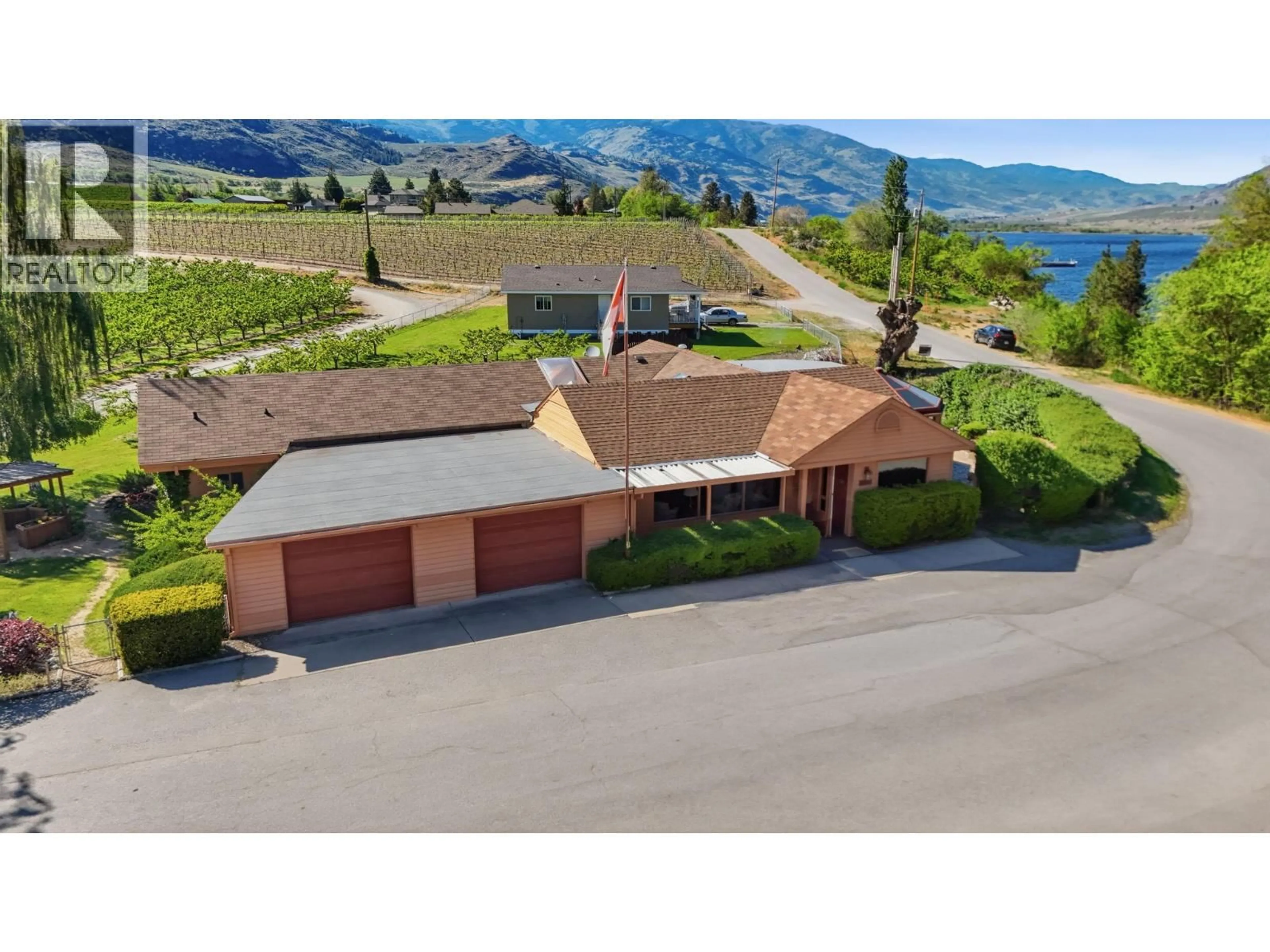 A pic from outside/outdoor area/front of a property/back of a property/a pic from drone, mountain view for 15230 89TH STREET, Osoyoos British Columbia V0H1V2