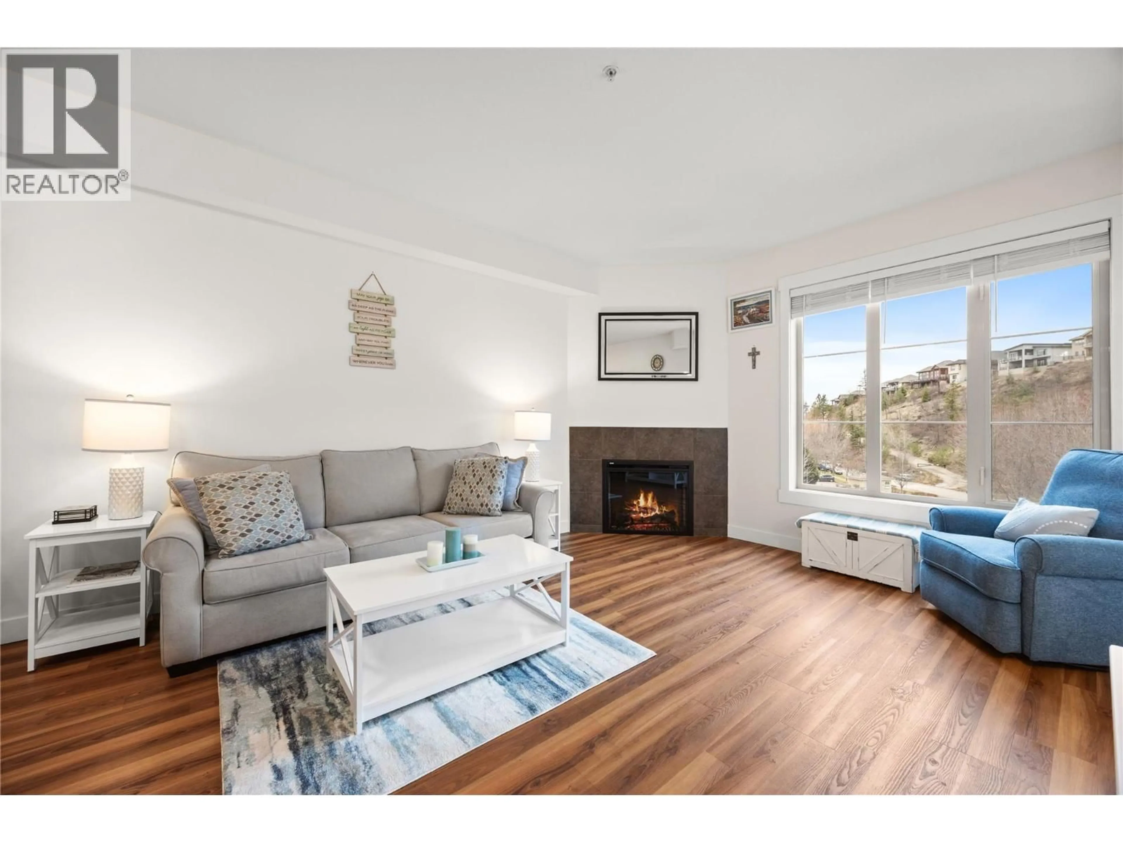Living room with furniture, wood/laminate floor for 1405 - 1875 COUNTRY CLUB DRIVE, Kelowna British Columbia V1V2W7