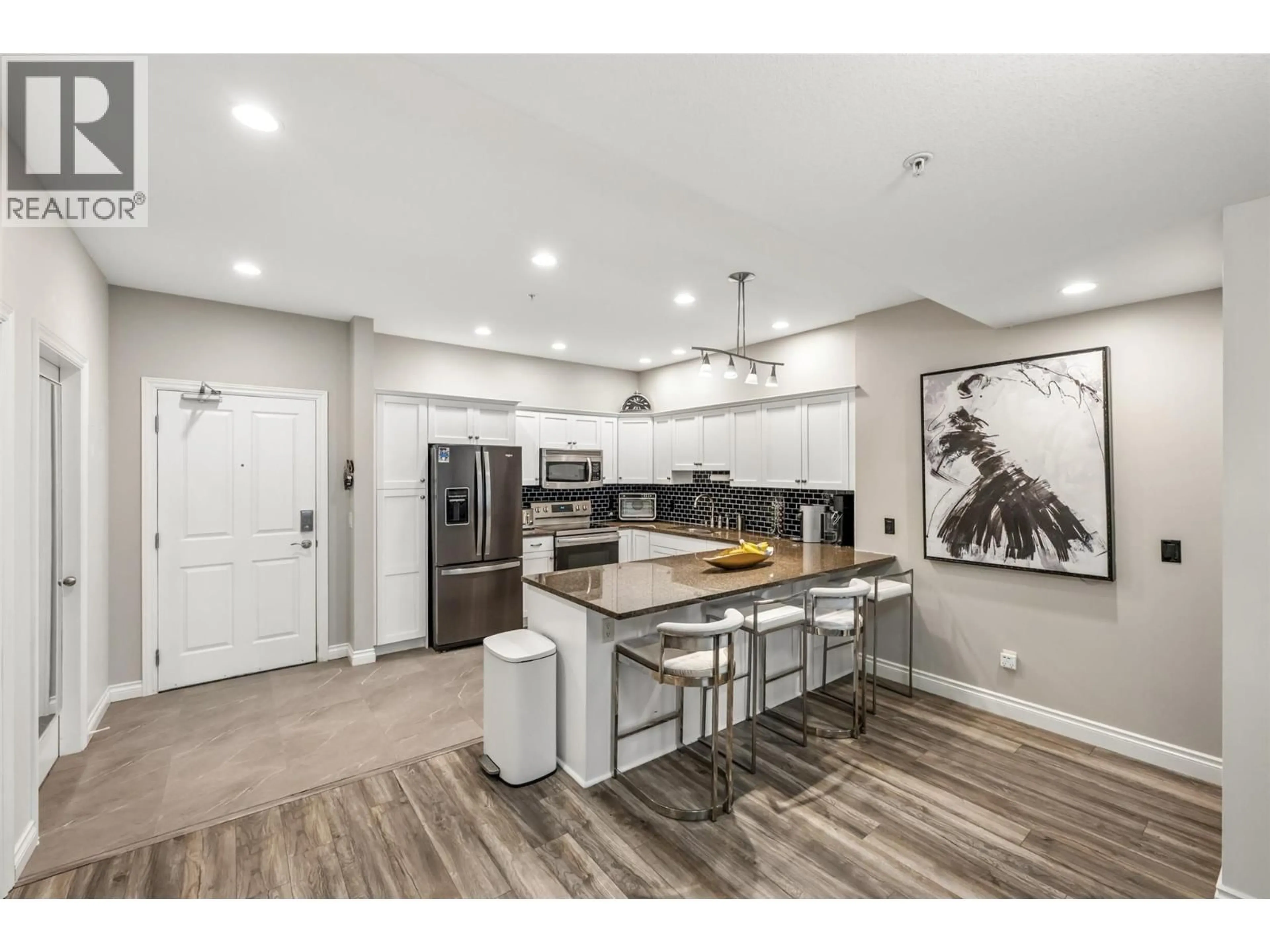 Open concept kitchen, wood/laminate floor for 4209 - 3842 OLD OKANAGAN HIGHWAY, West Kelowna British Columbia V4T3G7