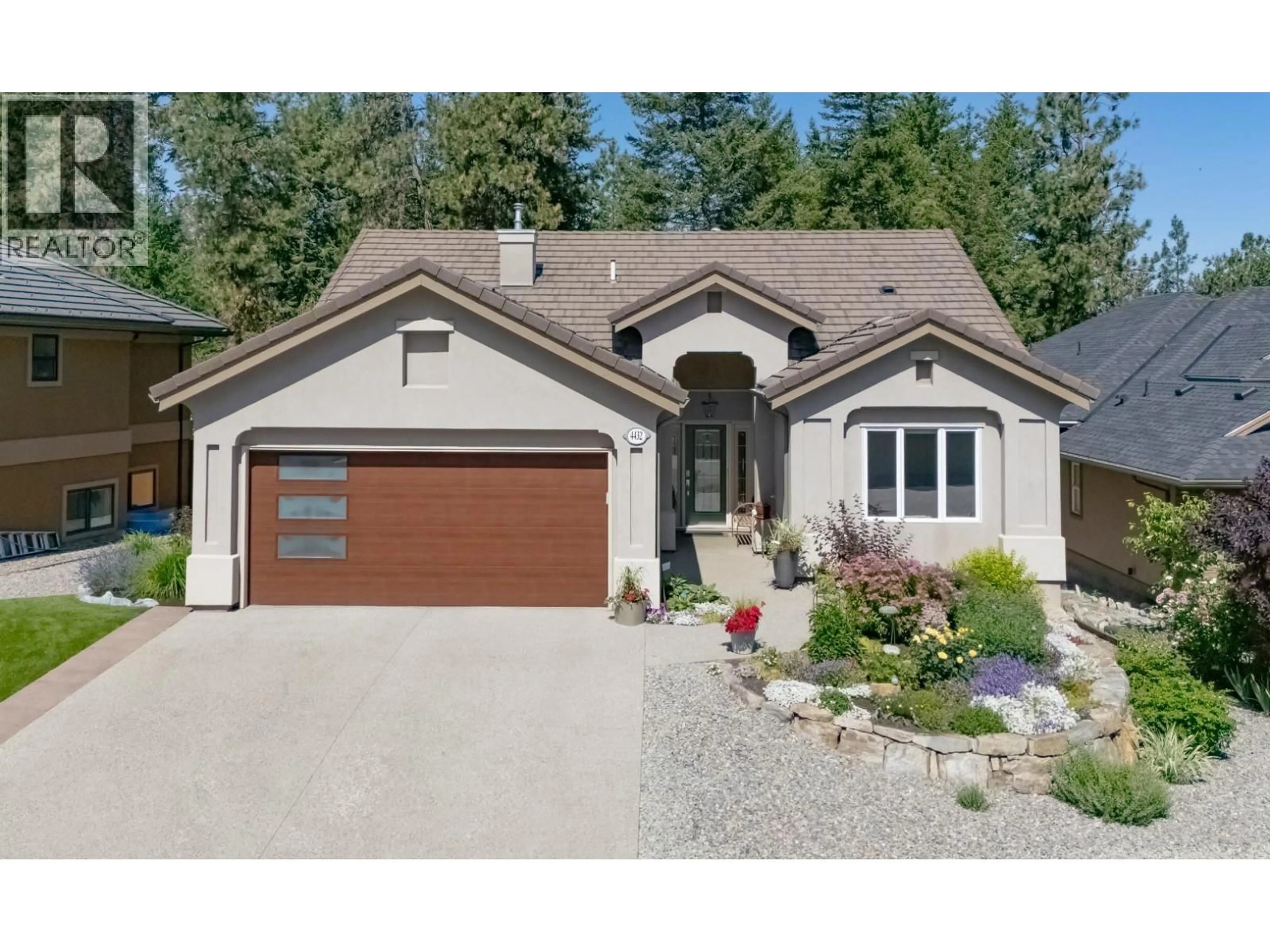 Home with vinyl exterior material, street for 4432 GALLAGHERS FOREST SOUTH, Kelowna British Columbia V1W4X3