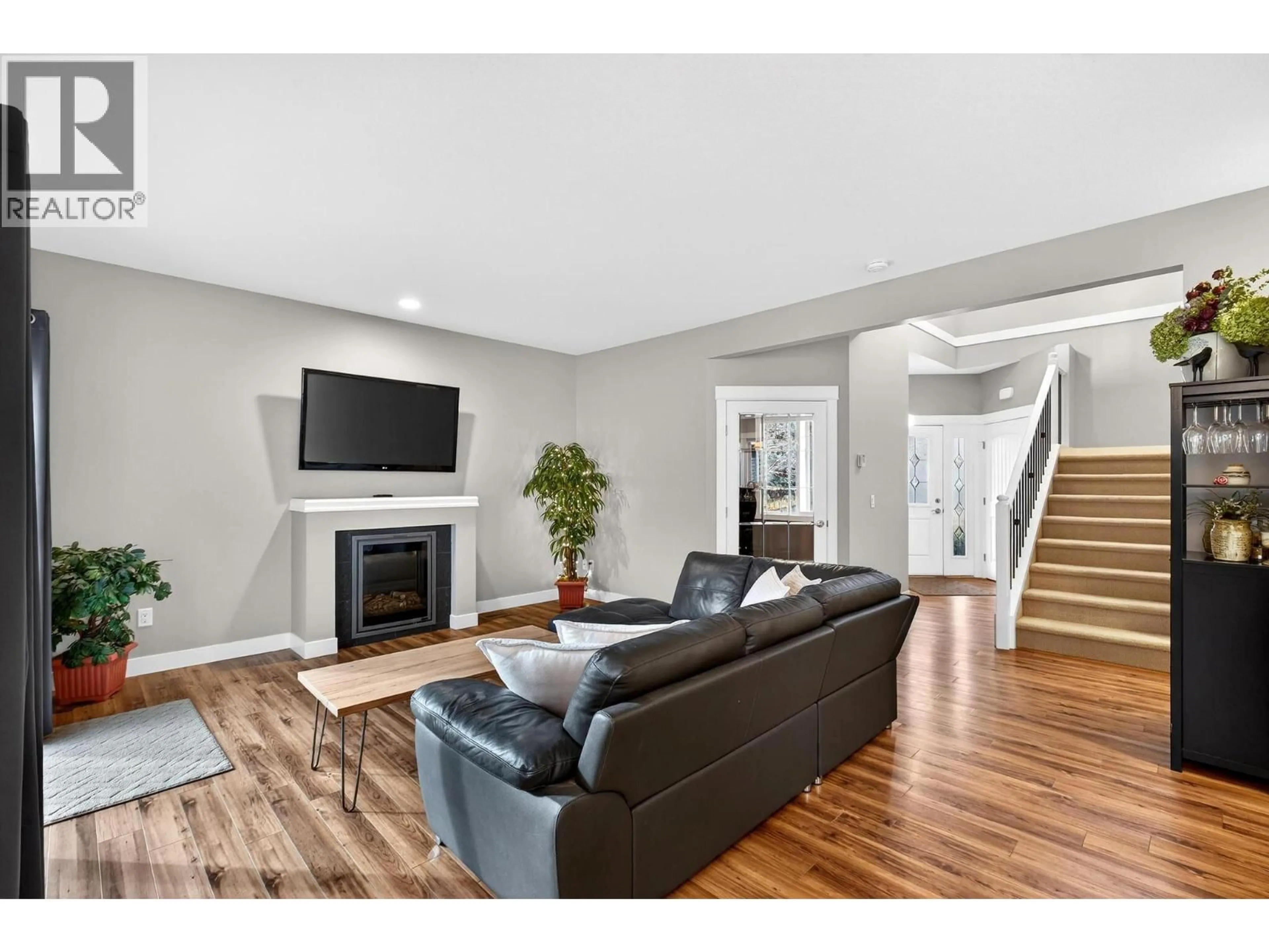 Living room with furniture, wood/laminate floor for 44 - 3293 BROADVIEW ROAD, West Kelowna British Columbia V4T3C8