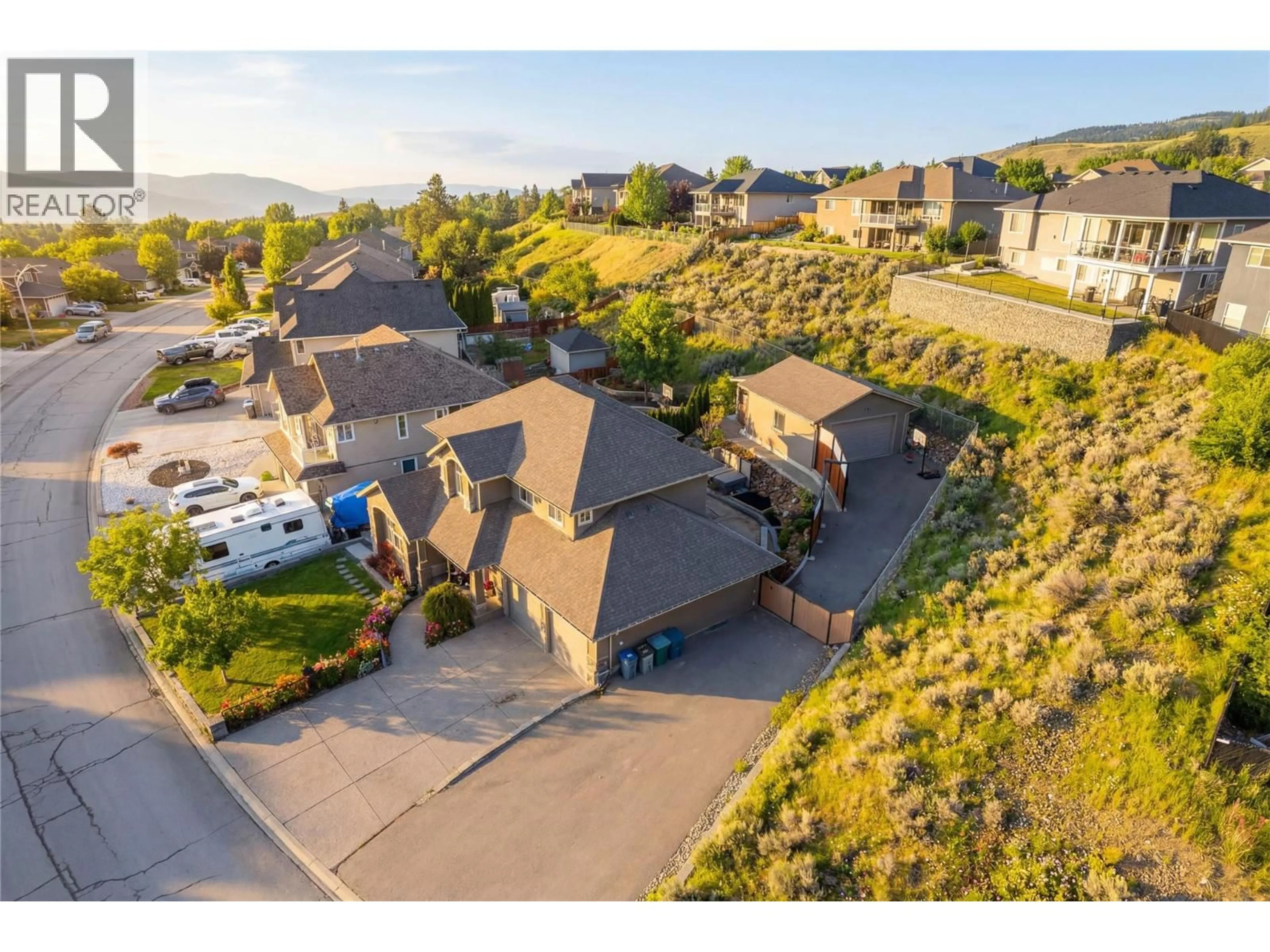 A pic from outside/outdoor area/front of a property/back of a property/a pic from drone, mountain view for 1052 QUAIL DRIVE, Kamloops British Columbia V2B8N9