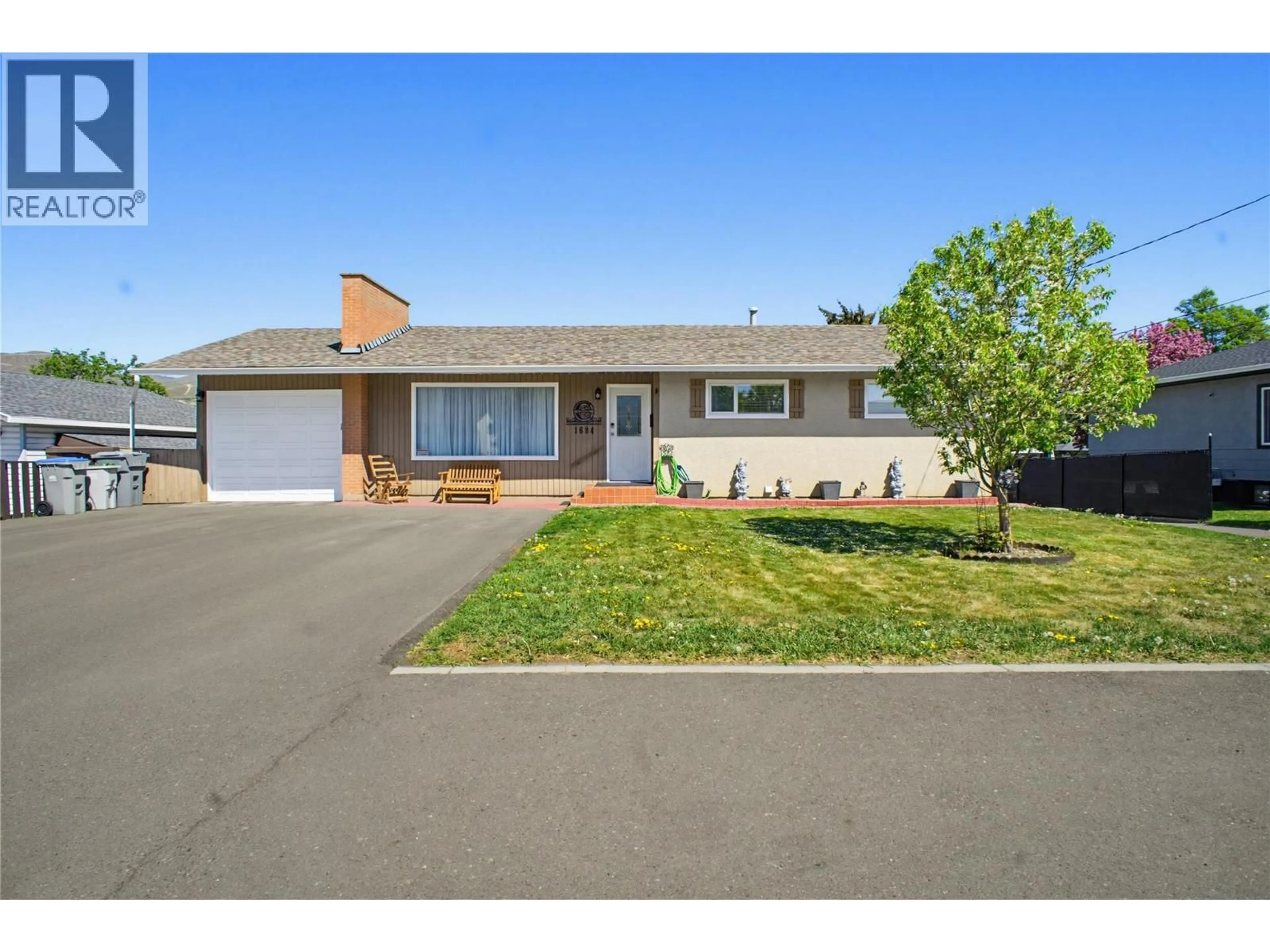 Home with vinyl exterior material, street for 1684 GREENFIELD AVENUE, Kamloops British Columbia V2B4N6