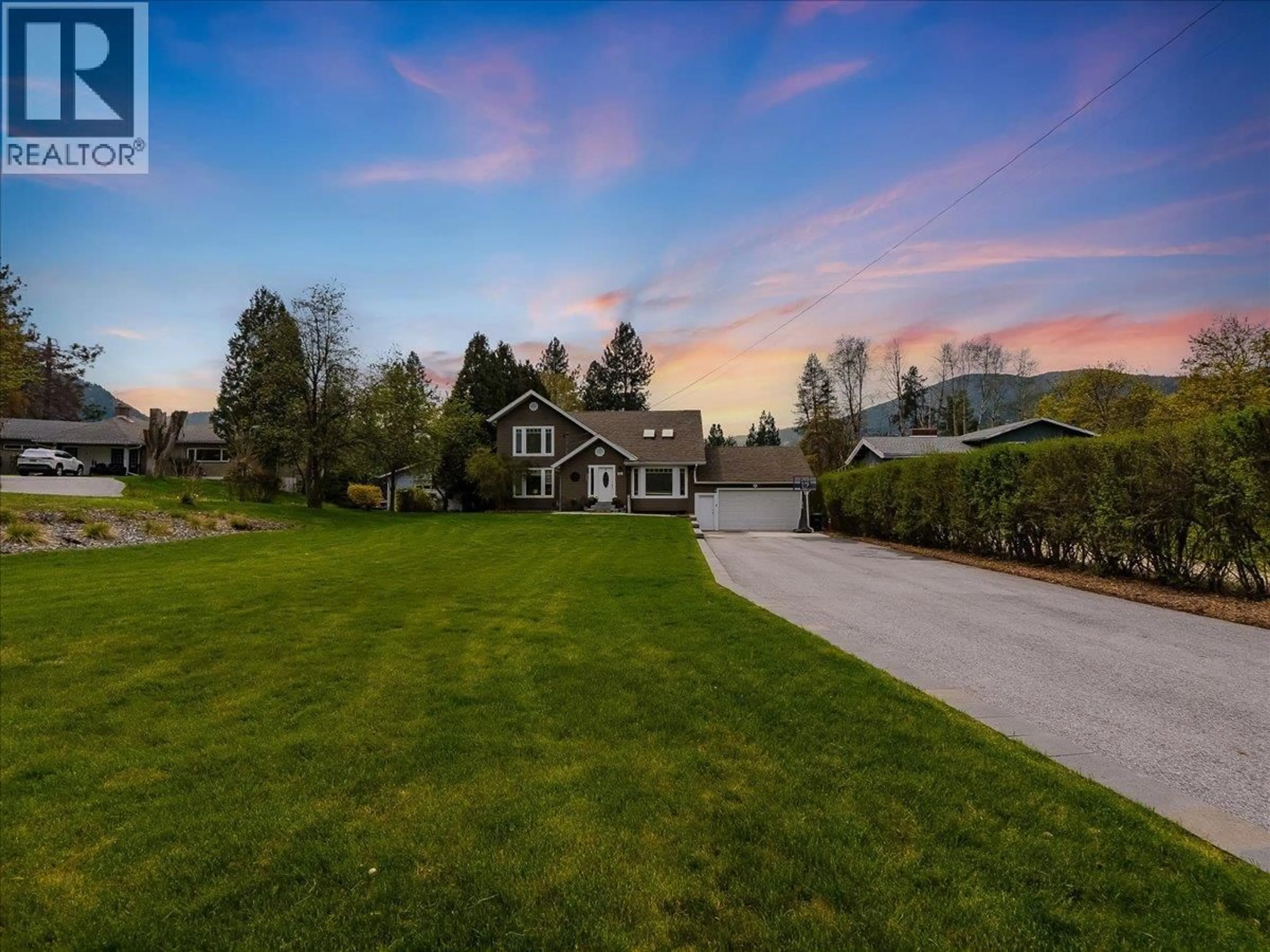 A pic from outside/outdoor area/front of a property/back of a property/a pic from drone, mountain view for 148 100TH STREET, Castlegar British Columbia V1N3C5