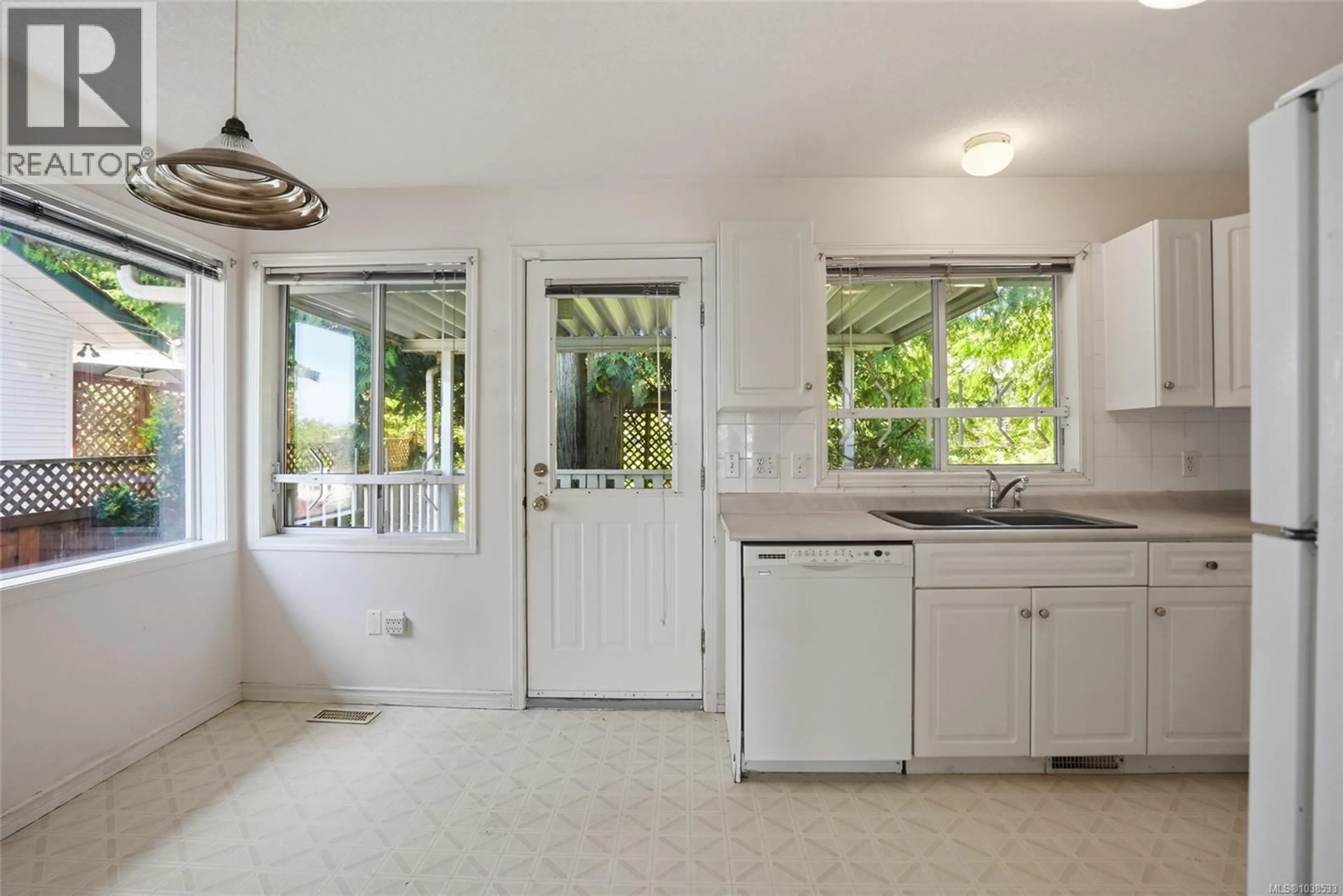 Open concept kitchen, ceramic/tile floor for 5684 CARRINGTON ROAD, Nanaimo British Columbia V9T6C2